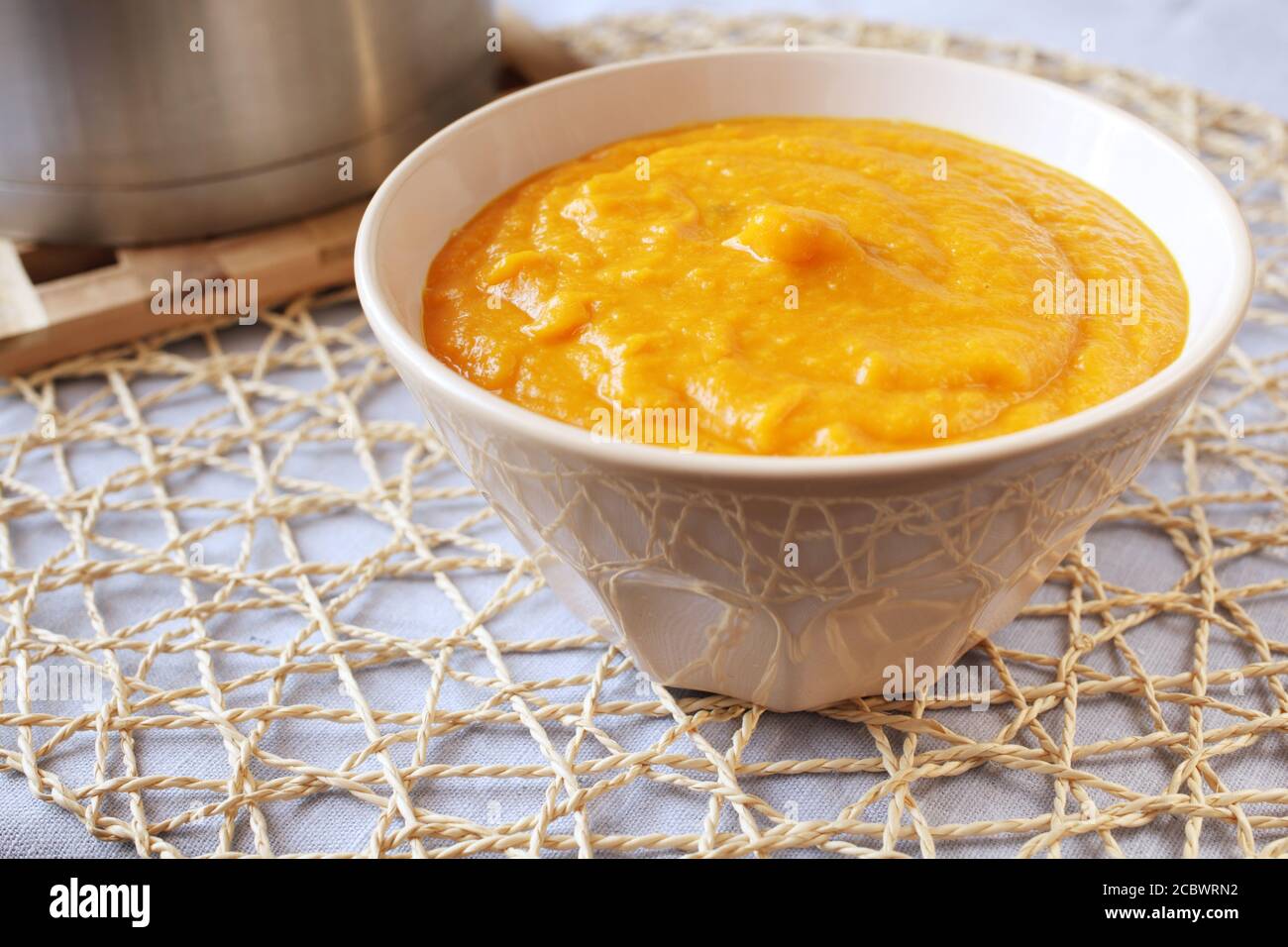 Pumpkin puree in a bowl closeup Stock Photo