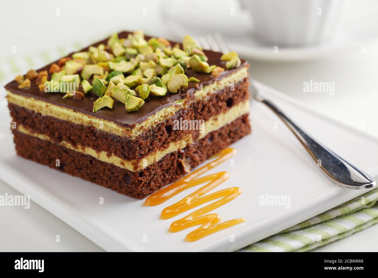 Chocolate cake with Pistachio nuts closeup Stock Photo