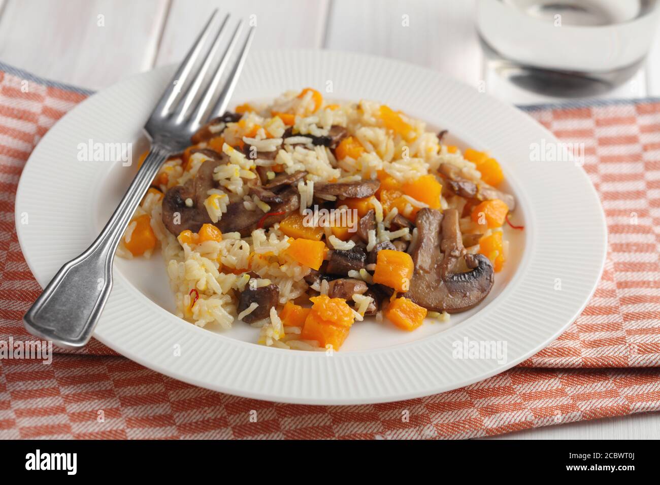 Mushroom and pumpkin vegetarian pilaf served in country style Stock Photo