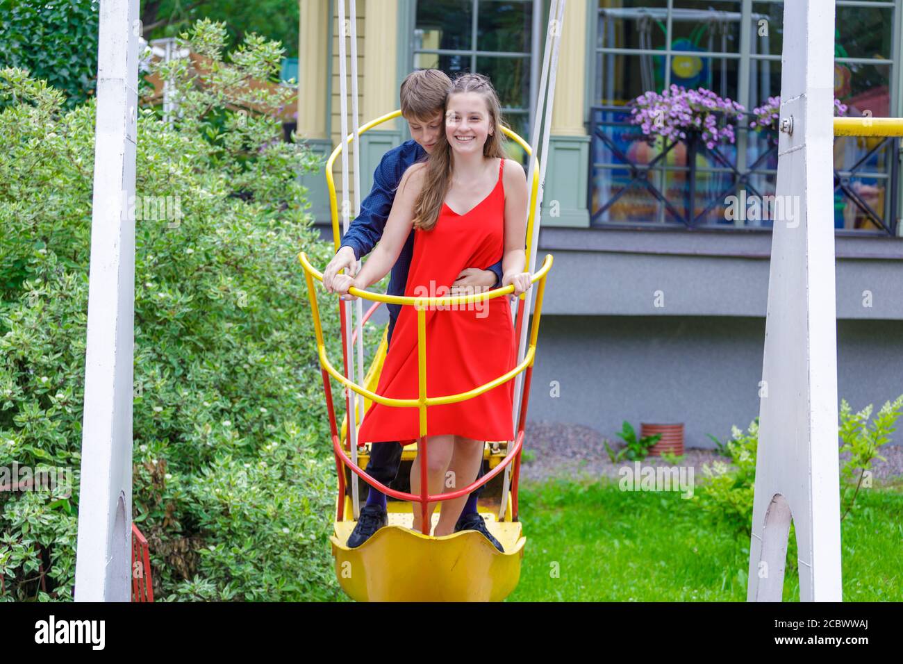 young couple having fun in the amusement park Stock Photo - Alamy