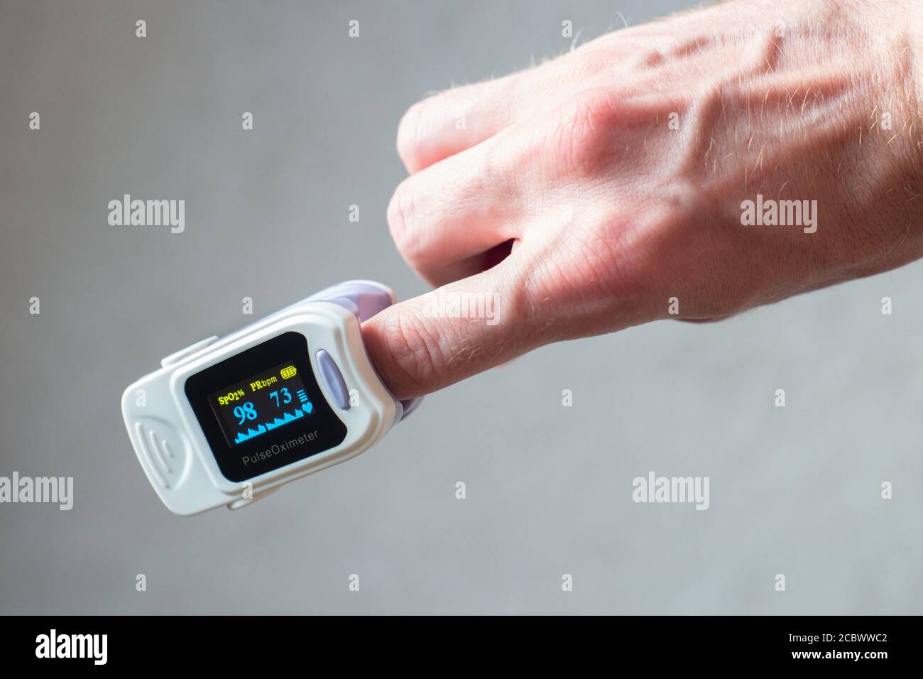 Blood oxygen saturation meter, or pulse oximeter, for measuring oxygen saturation in blood or 'sats'. Also provides pulse rate. Non invasive device Stock Photo