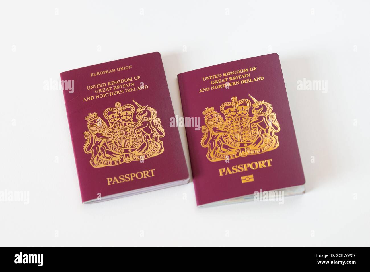 Two red or burgundy UK passports one with European Union heading and one without. leave, EU, brexit, 2020, UK Stock Photo