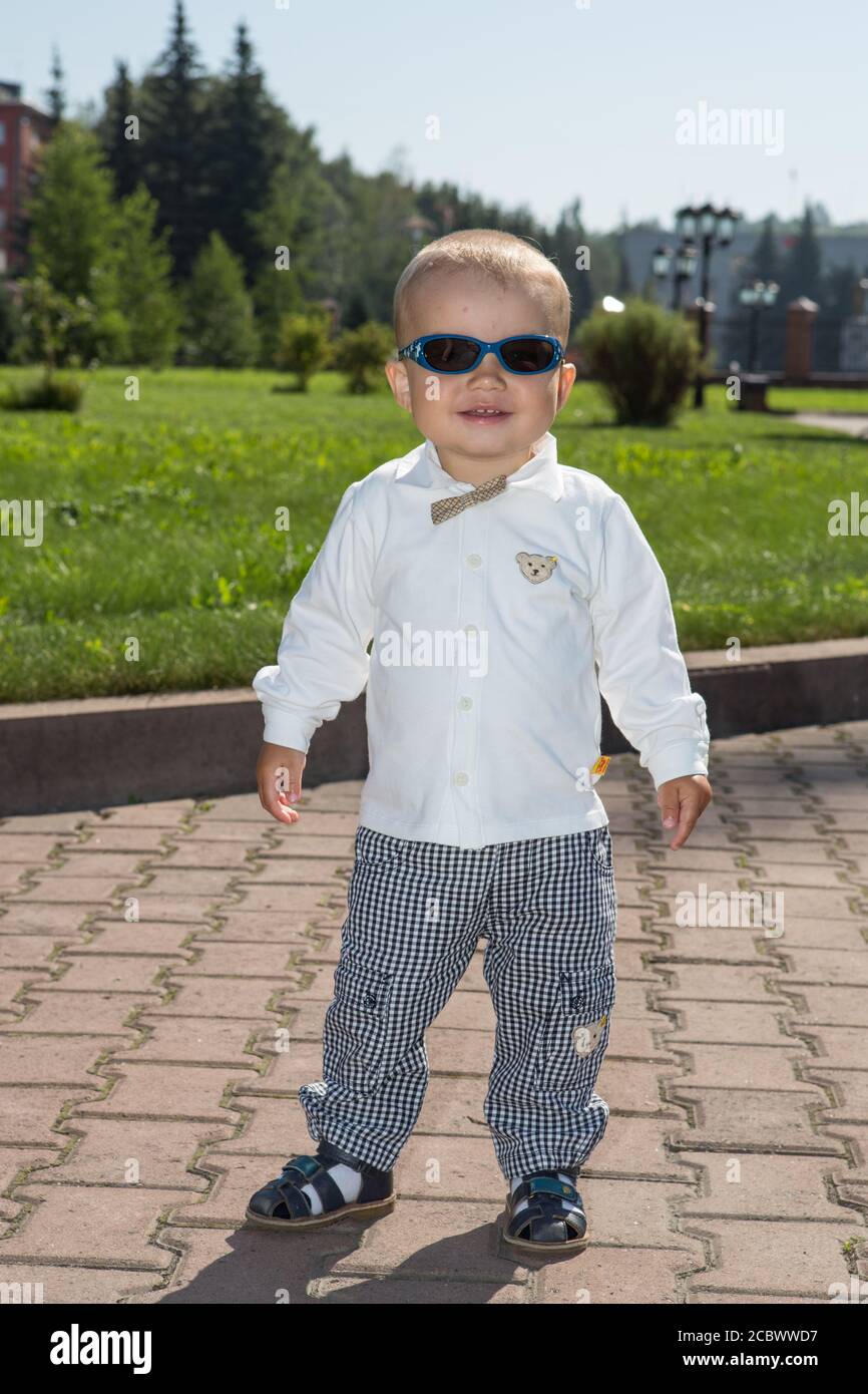 Boy Wearing Sunglasses Behind A Dark Background, Cool Profile