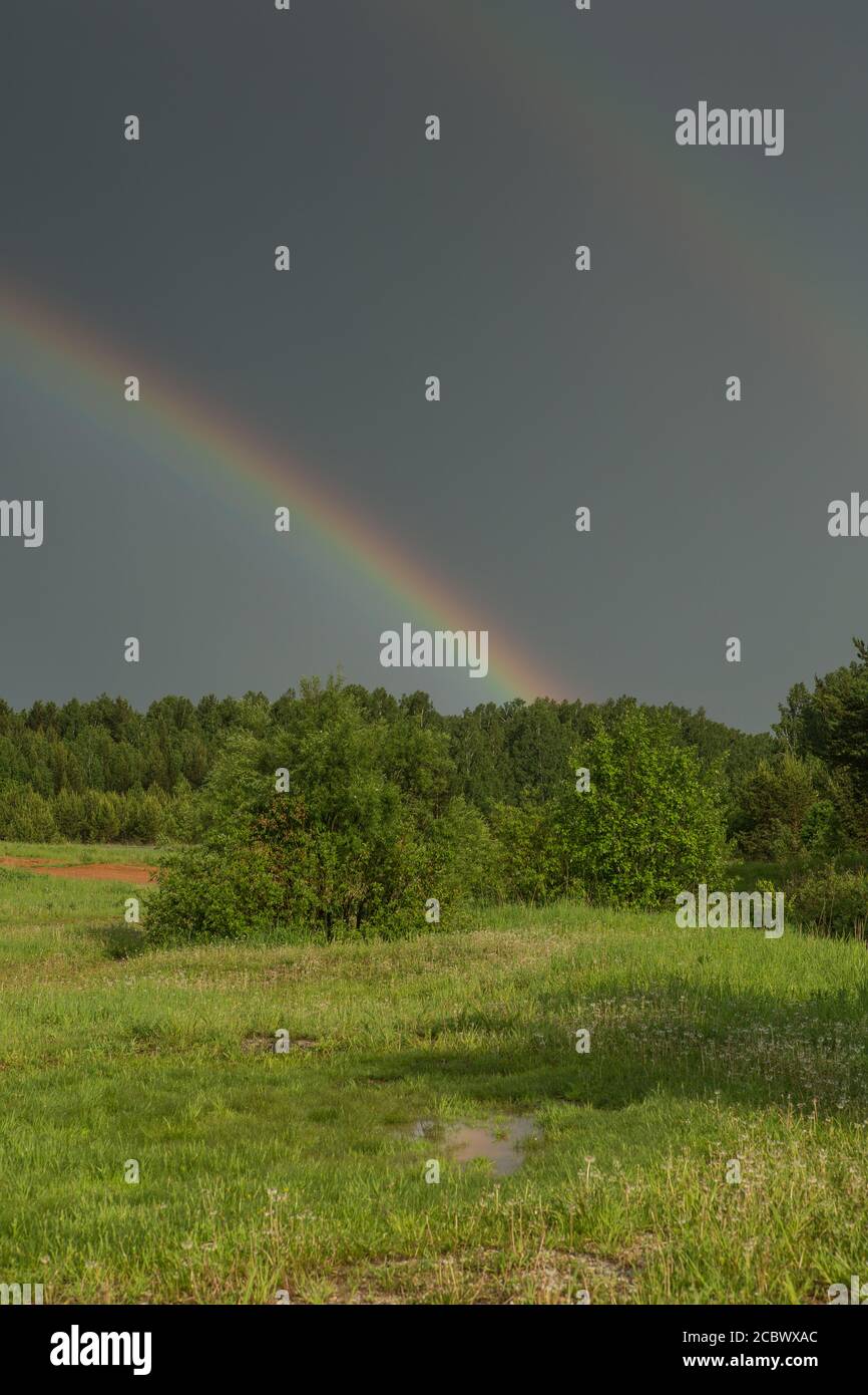 Mountain landscape with rainbow after a thunderstorm hi-res stock ...