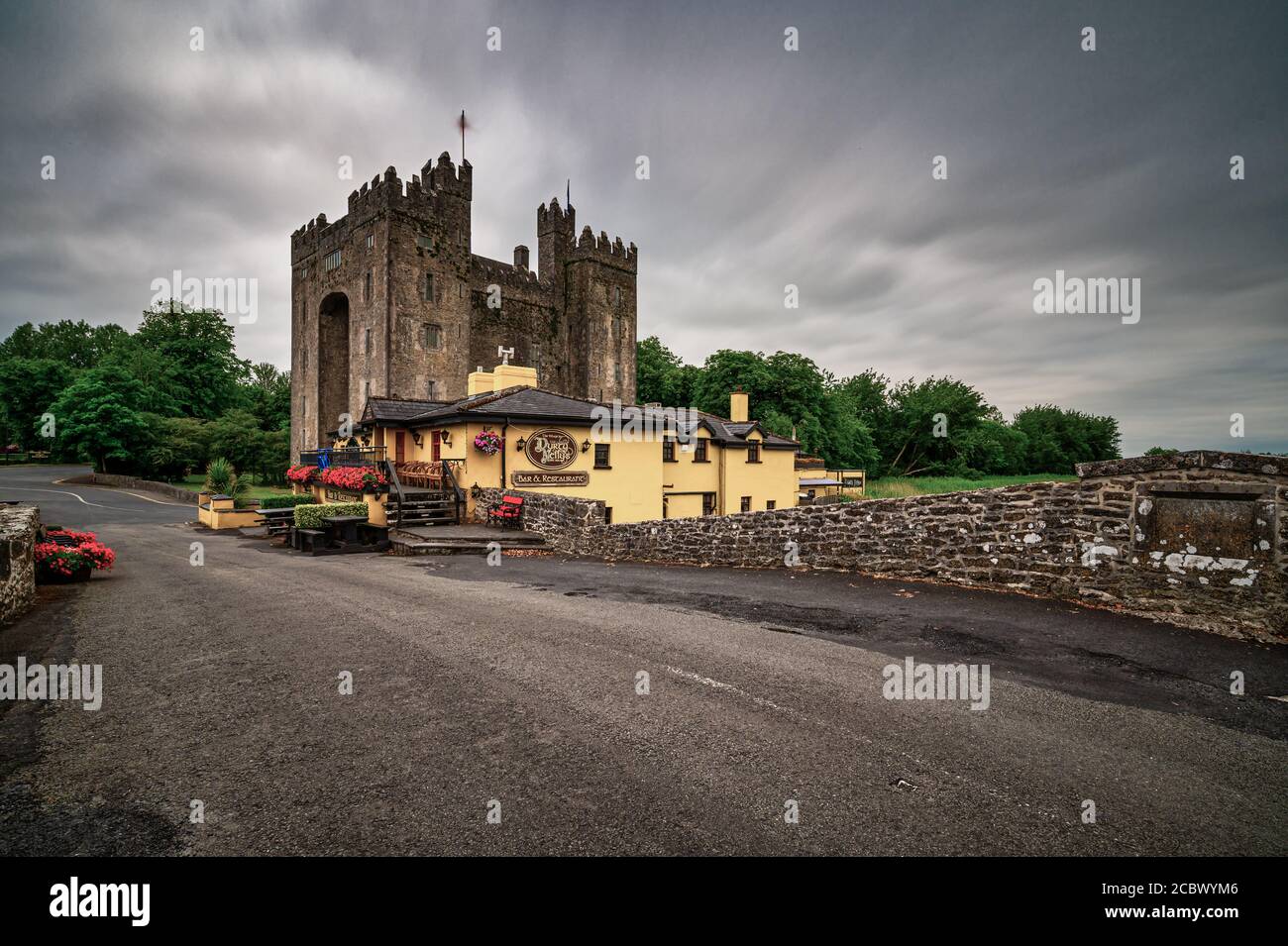 Bunratty Castle is a large 15th-century tower house in County Clare, Ireland. It is located in the centre of Bunratty village, by the N18 road between Stock Photo