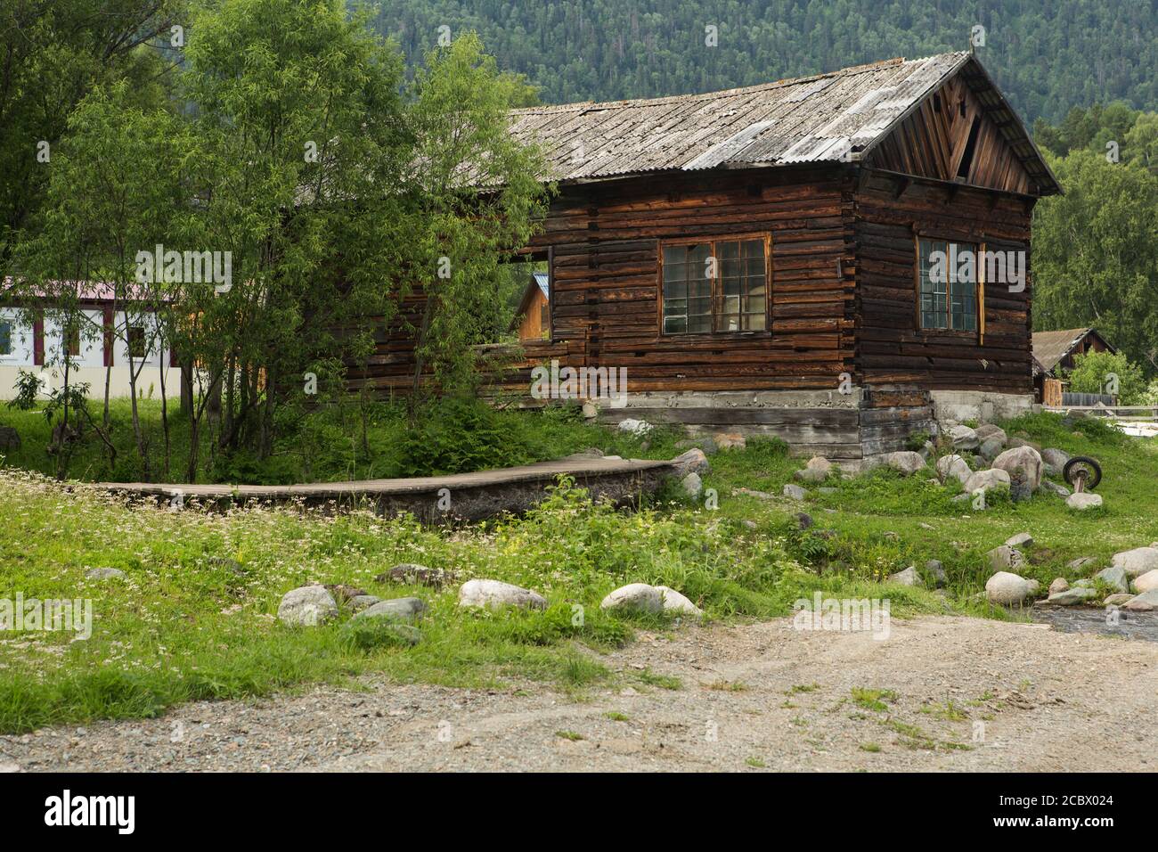 Old wooden house in the village summer day Stock Photo - Alamy