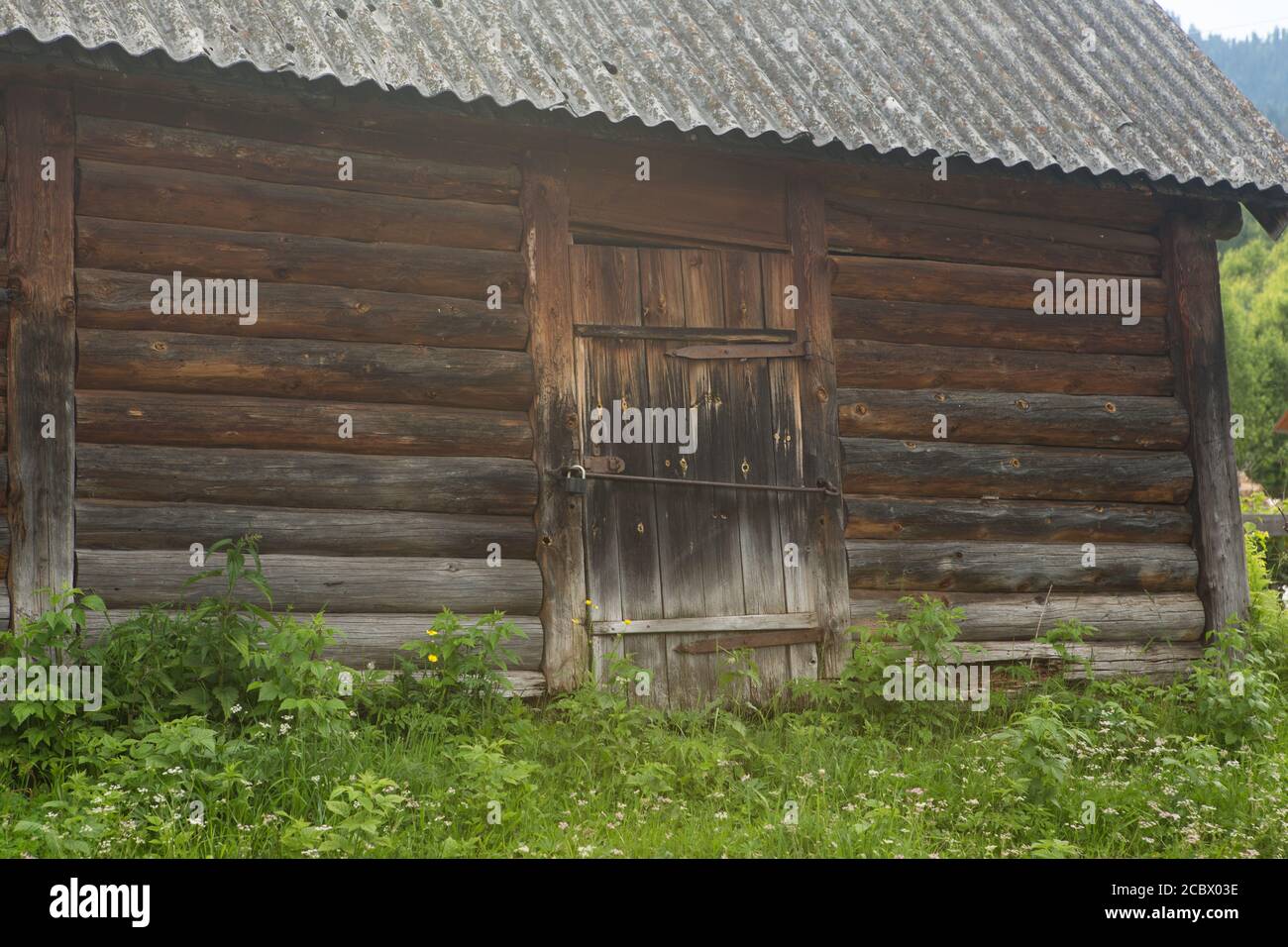 Old wooden house in the village summer day Stock Photo - Alamy
