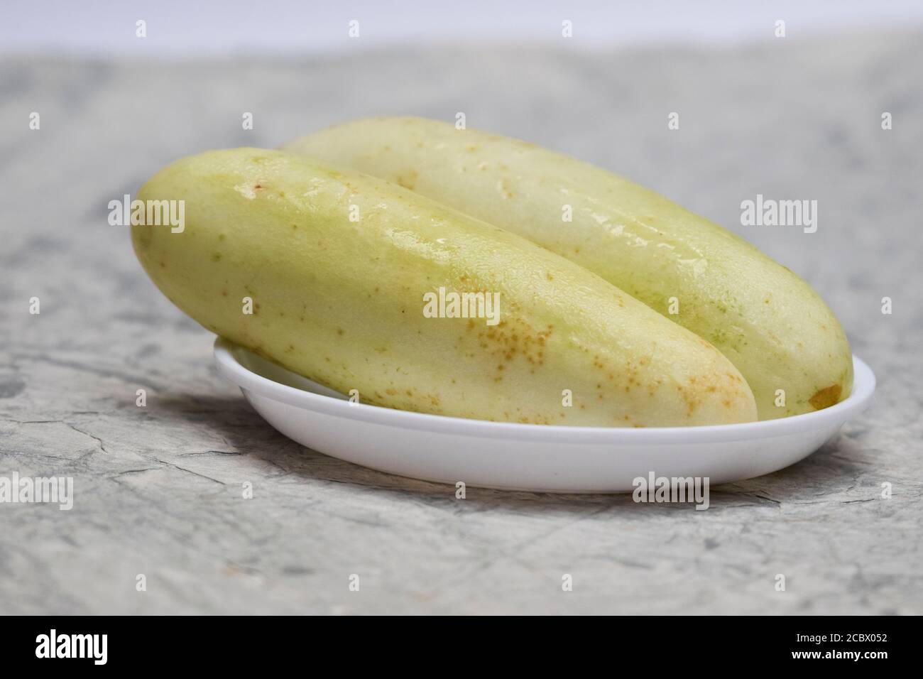 Side view of White cucumbers Stock Photo