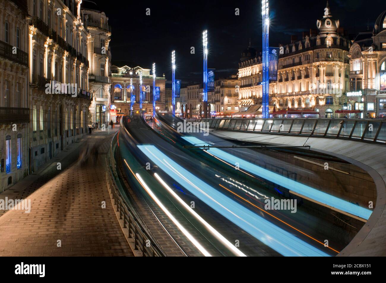 City public transport. Beautiful multi-colored tramway. The Montpellier tramway system has 4 lines and 84 stations France  Two trams crossing each oth Stock Photo