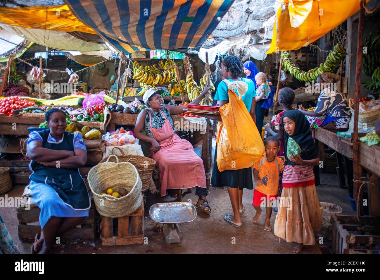 Woman selling vegetables in the market, Lamu town, Lamu Archipelago, Kenya Stock Photo