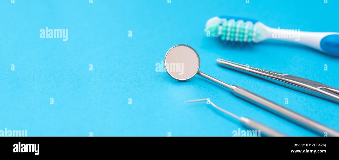 Professional dentist tools on blue background. Dental health care ...