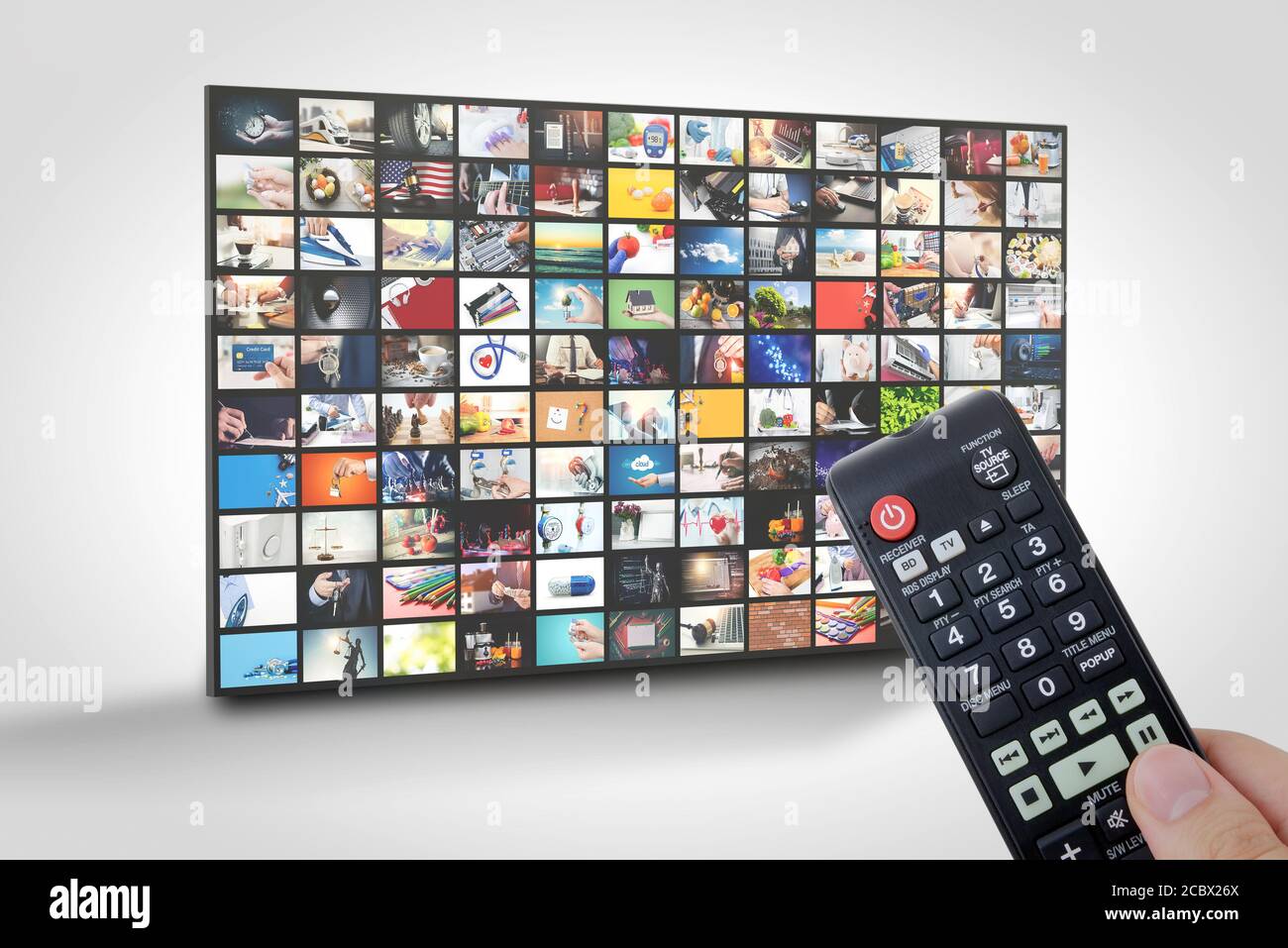 Television streaming, TV multimedia panel. Hand with remote control Stock Photo