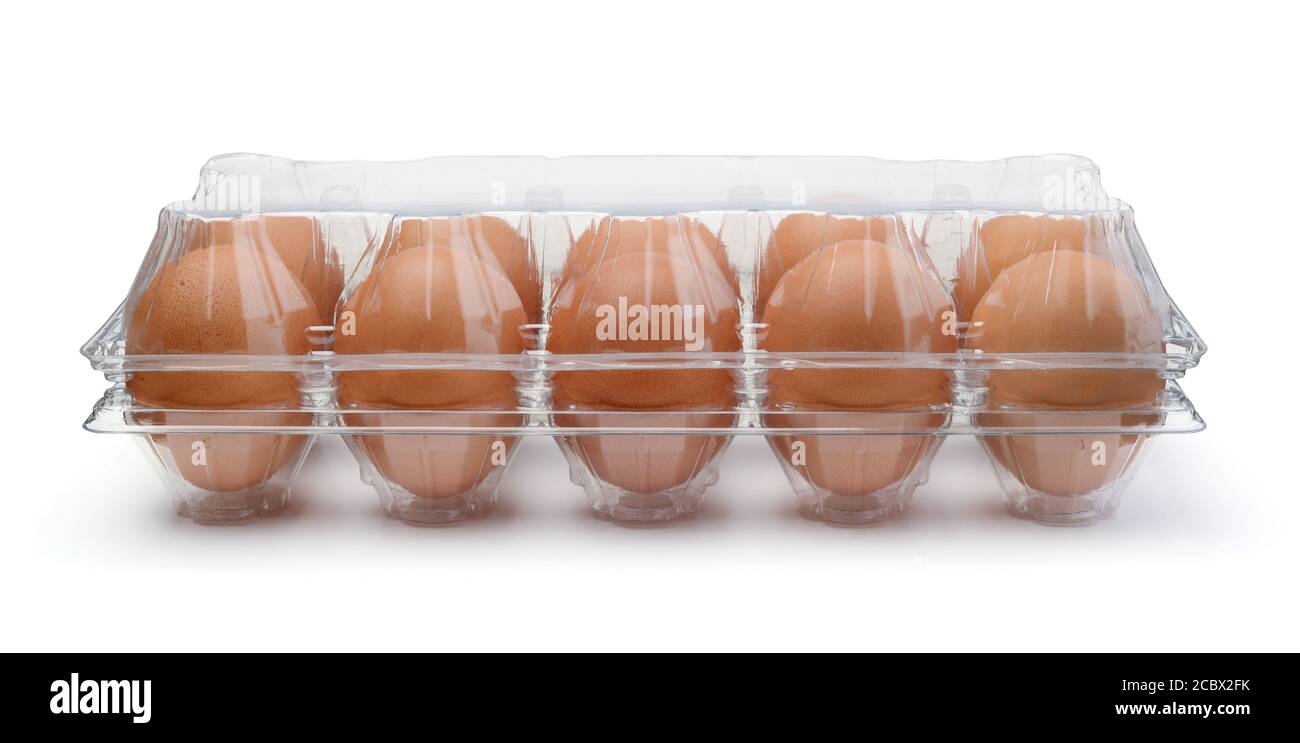 Fresh chicken eggs on plastic transparent container isolated on white. Stock Photo