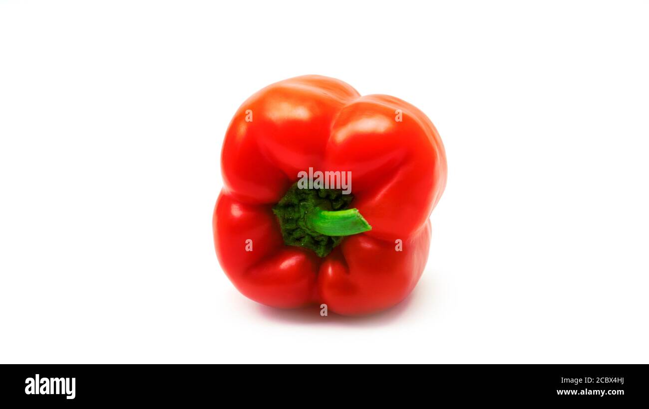 Red bell peppers on a white background Stock Photo - Alamy