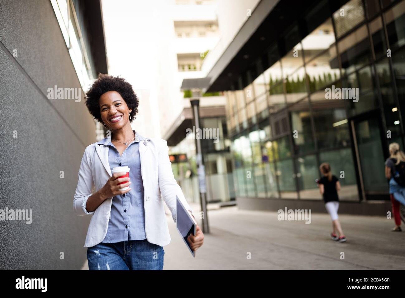 African woman walking hi-res stock photography and images - Alamy