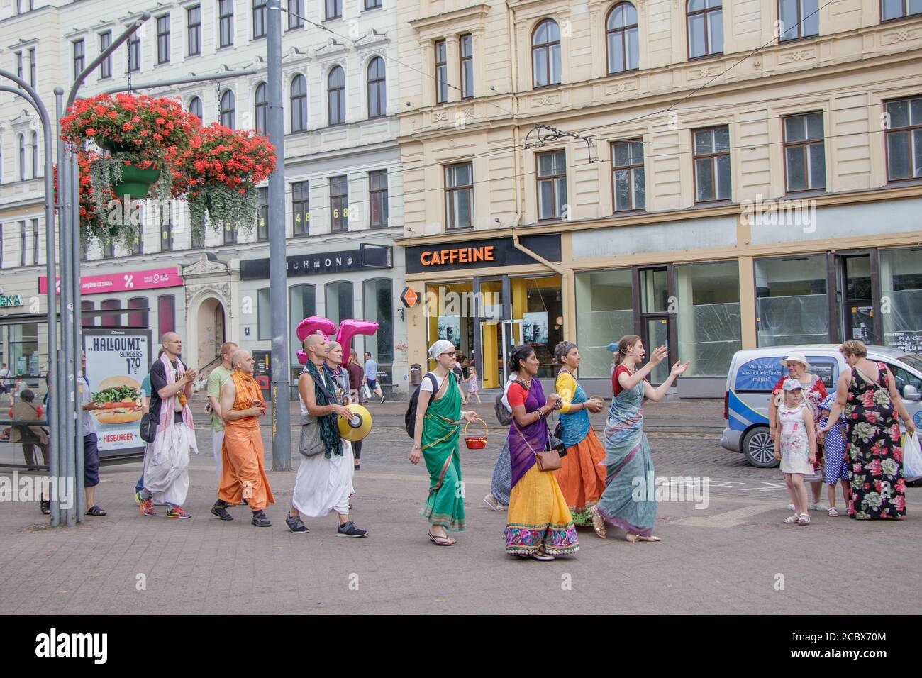Hare Krishna singings march through the street Stock Photo - Alamy