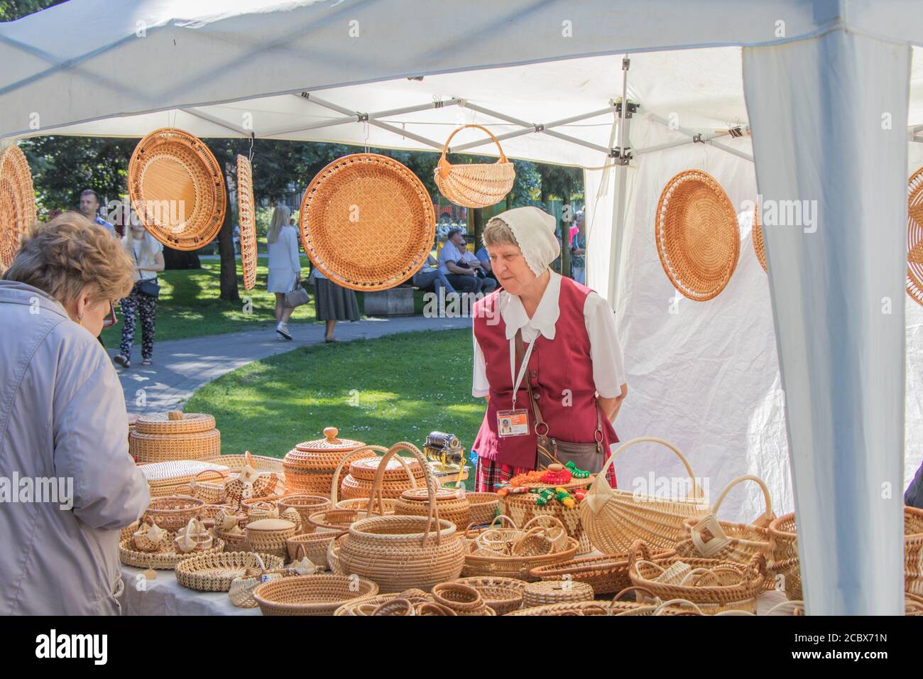 Elderly woman sells things from willow branches Stock Photo Alamy