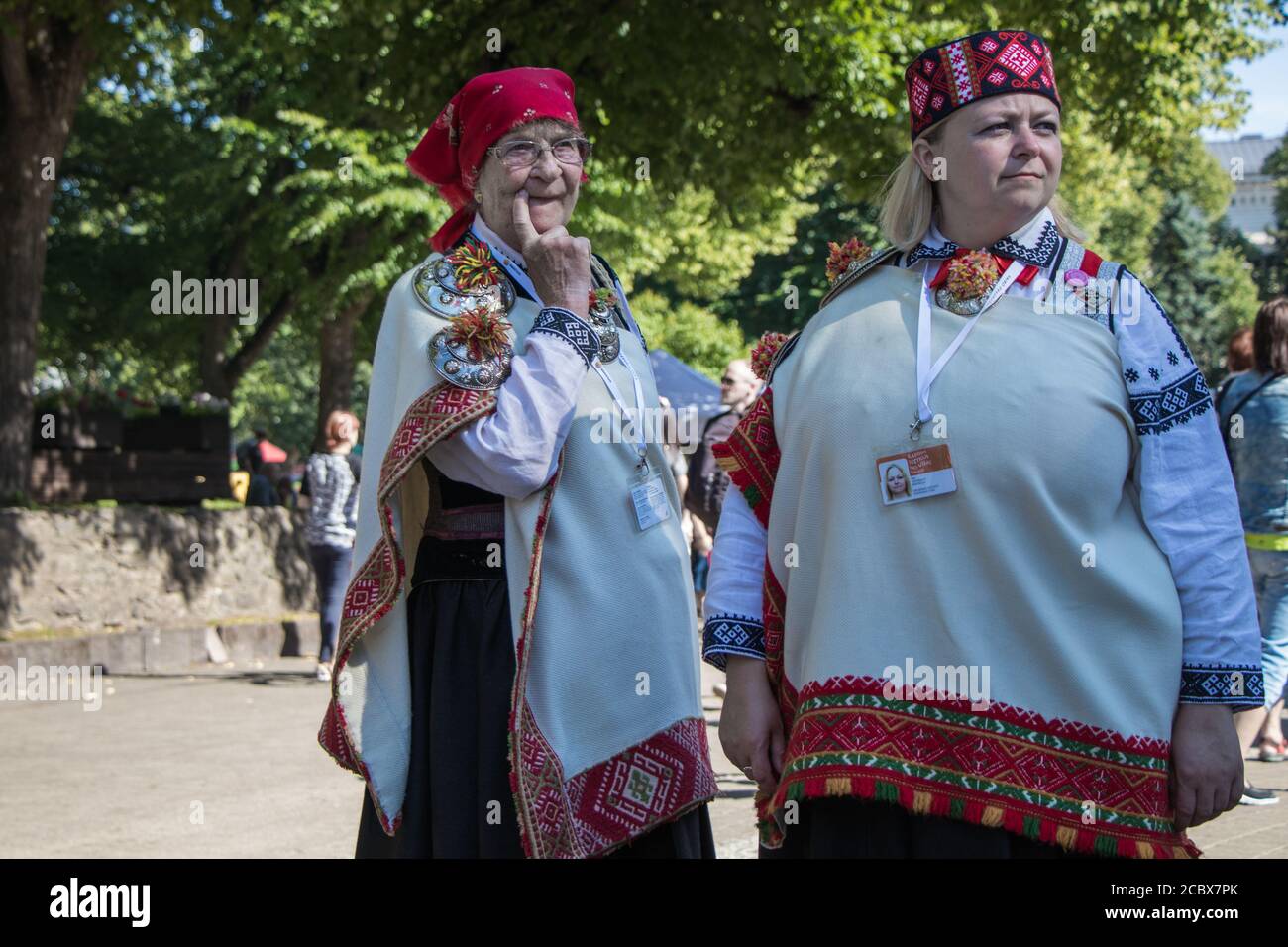 https://c8.alamy.com/comp/2CBX7PK/senior-woman-and-a-young-woman-in-national-latvian-clothes-are-walking-in-a-city-park-2CBX7PK.jpg