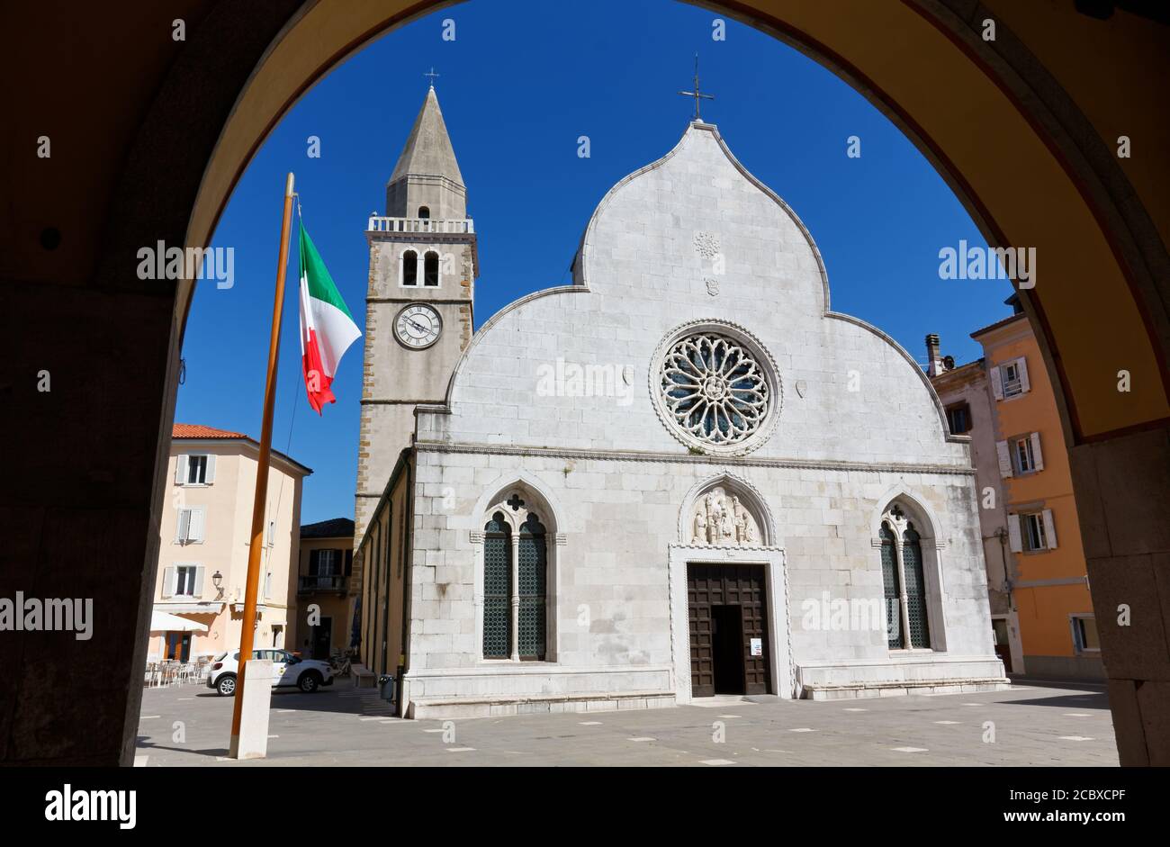 Facade of the Duomo of Muggia, Italy, in Marconi square, precious example of Venetian gothic style. Stock Photo