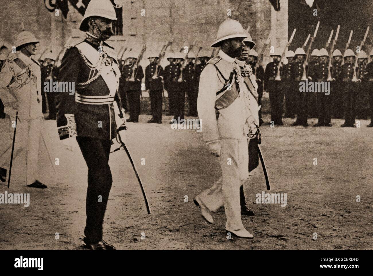 George V (1865- 1936) was King of the United Kingdom and the British Dominions, and Emperor of India, from 6 May 1910 until his death in 1936. He is seen here with Lord Kitchener  in 1910 at Port Sudan on the Red Sea. Stock Photo