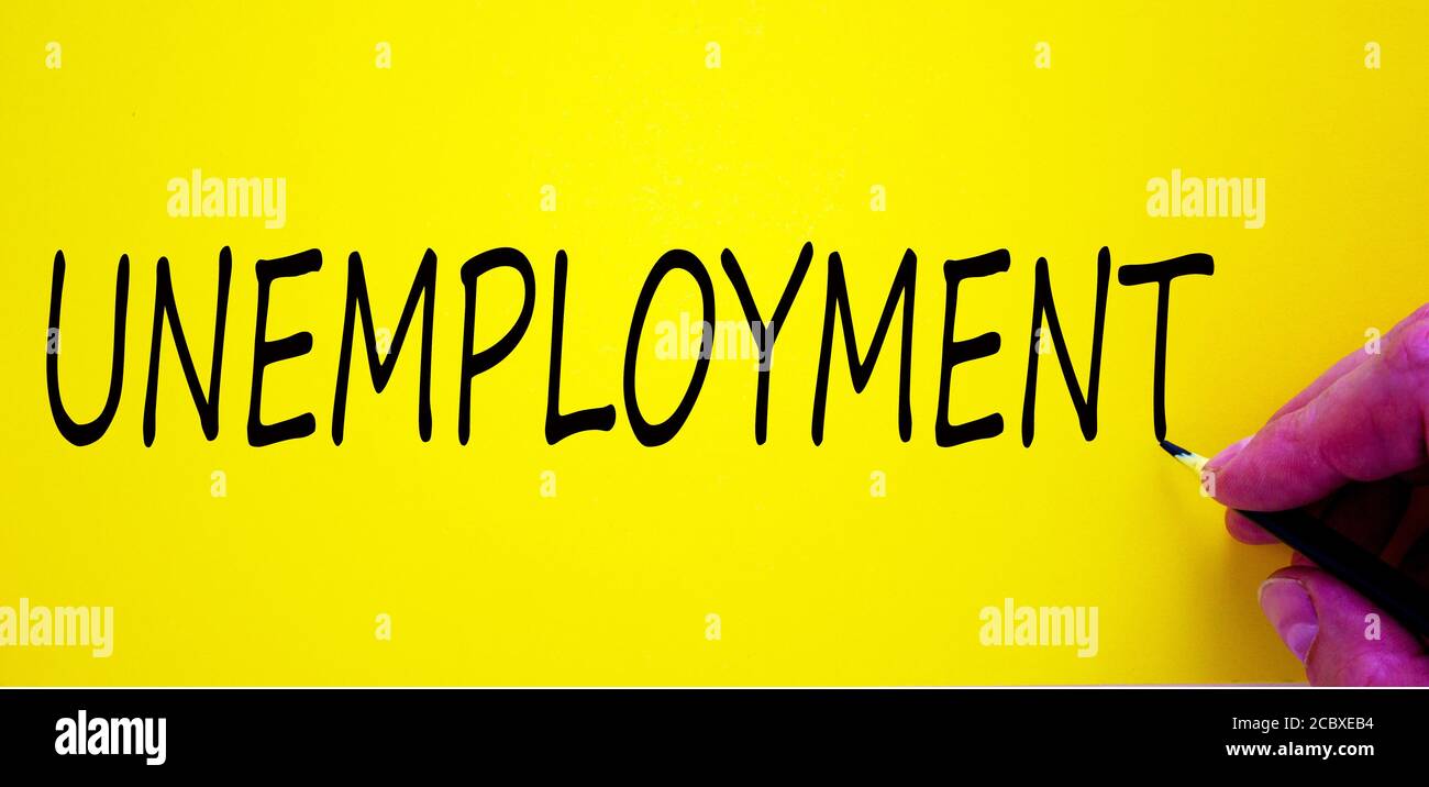 Unemployed Writing Hand writing 'unemployment', isolated on yellow background. Business ...