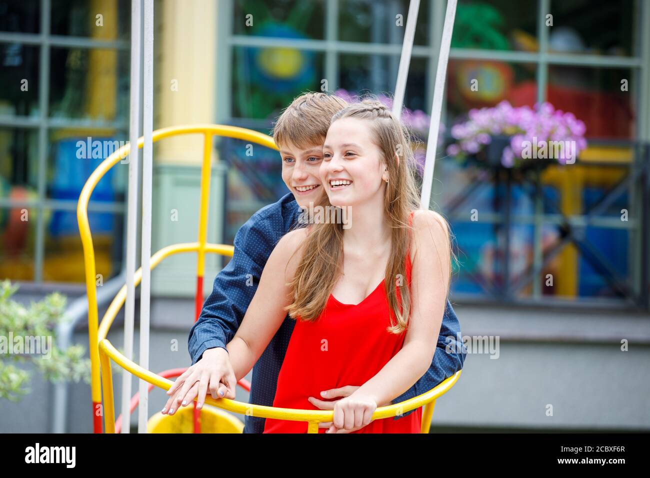 young couple having fun at attractions in the park in summer Stock ...