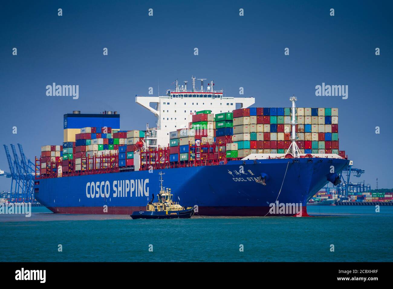 Cosco Shipping Container Ship enters Felixstowe Port - The Cosco Shipping vessel the CSCL Star approaches the docks at Felixstowe Port, in the UK. Stock Photo
