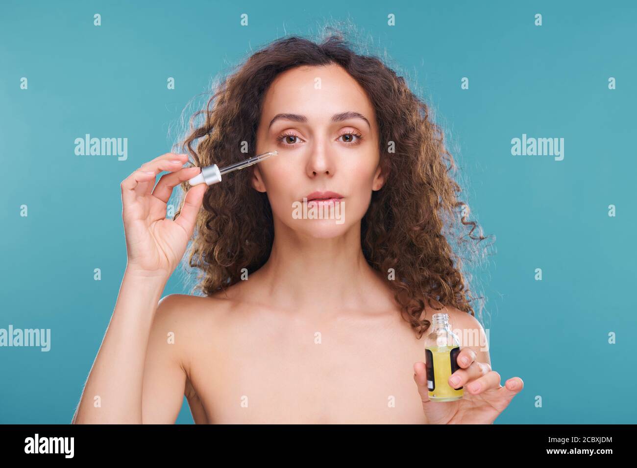 Woman serum face applying hi-res stock photography and images - Alamy