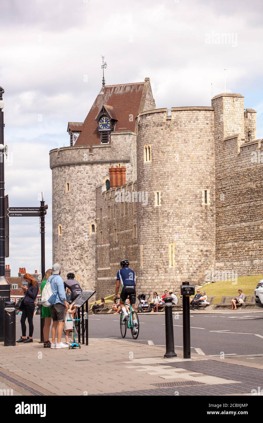Tourists visitors and day tippers take in the view of Windsor Castle England UK Stock Photo