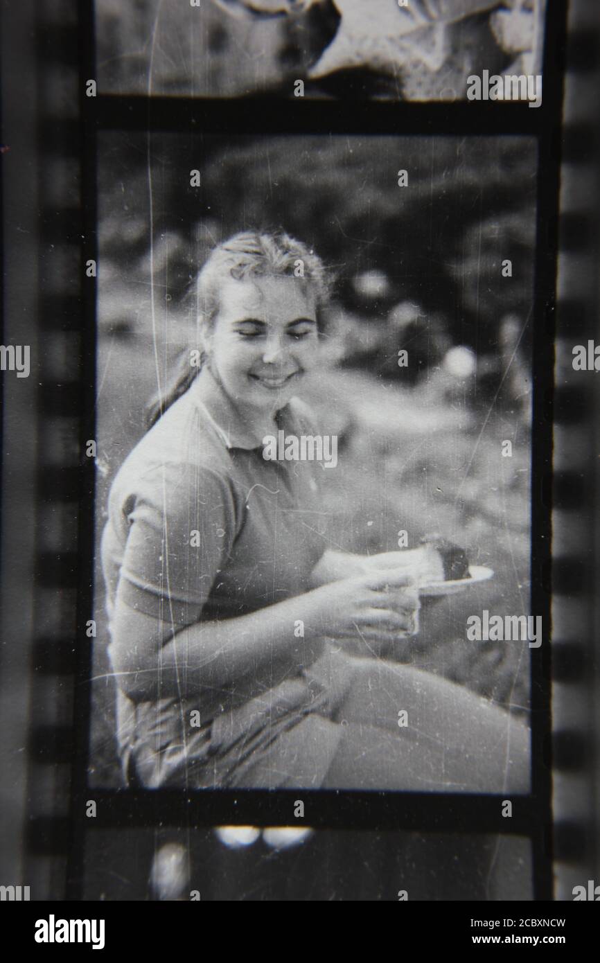 Fine 1970s vintage black and white photography of a beautiful young teenage girl enjoying her summer. Stock Photo