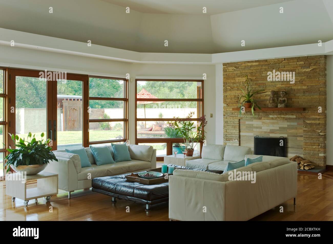 Contemporary Living Room with Rough stone fireplace Stock Photo