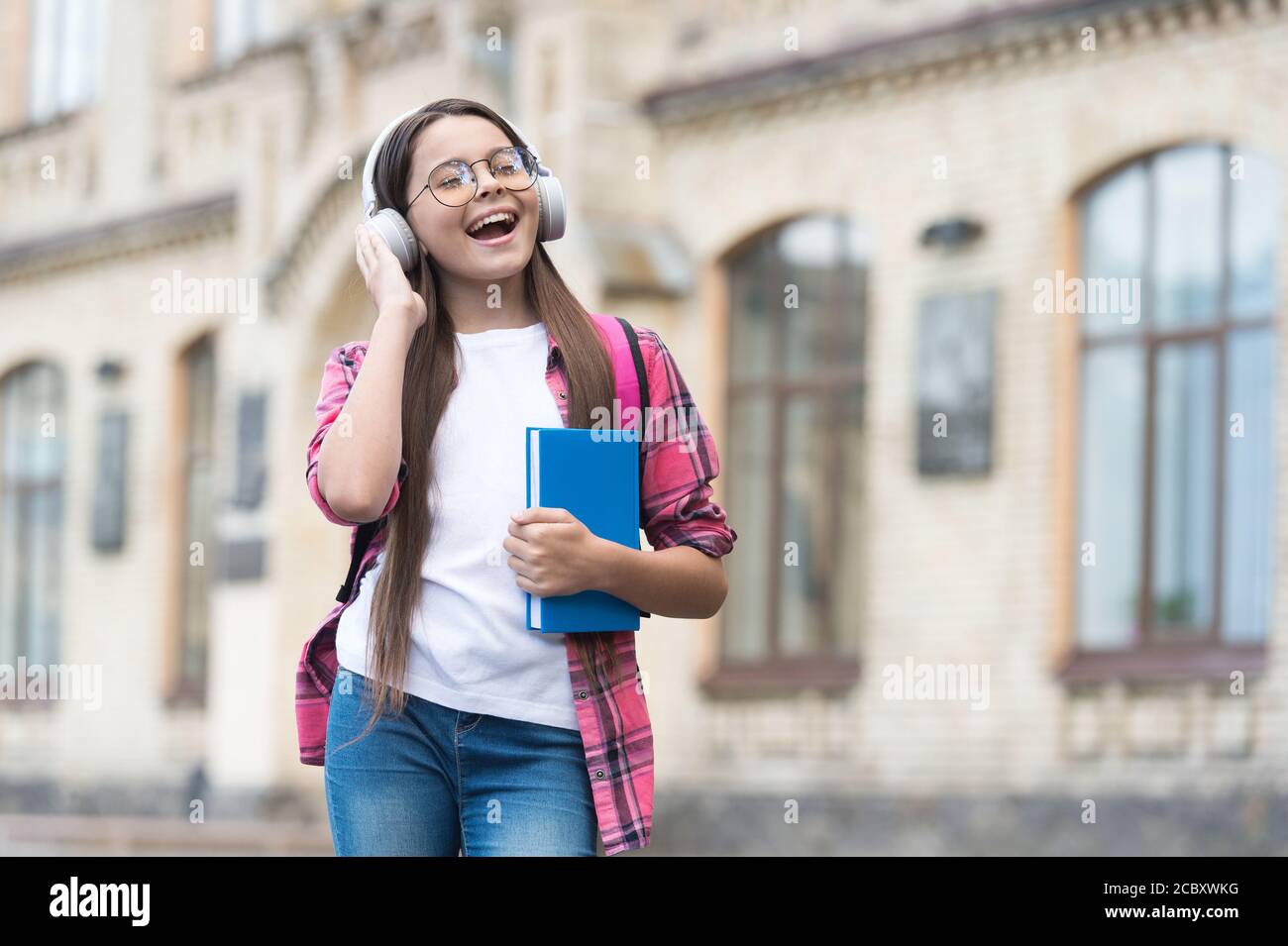 Improve your spoken English. Happy kid listen and speak English