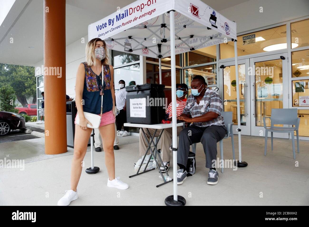 A voter drops off their mail-in voting ballot on the last day of early voting for the U.S. presidential election at the C. Blythe Andrews, Jr. Public Library in East Tampa, Florida, U.S., August 16, 2020.  REUTERS/Octavio Jones Stock Photo