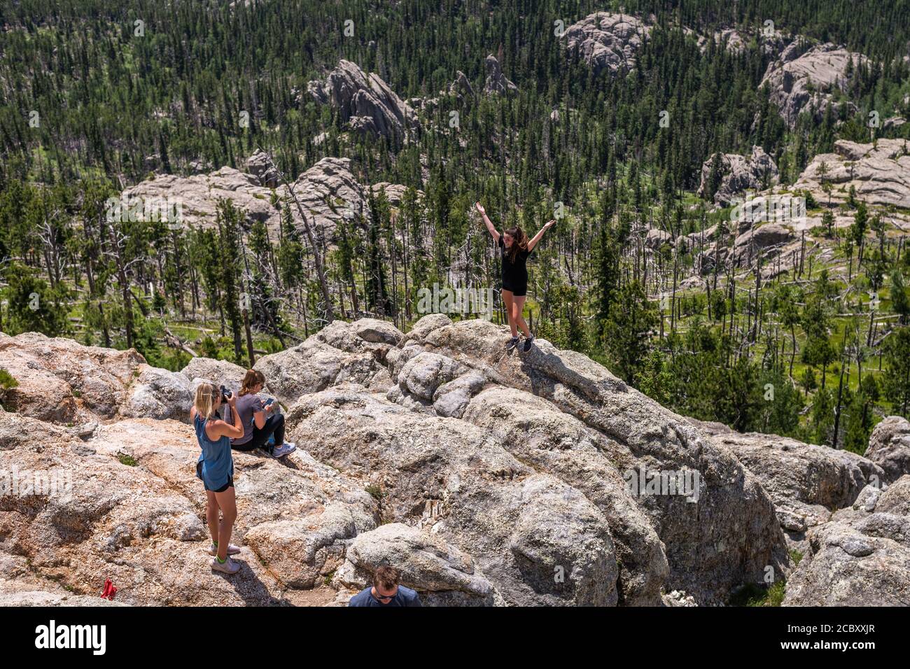 Hikers at the summit of Black Elk Peak, the highest point in South