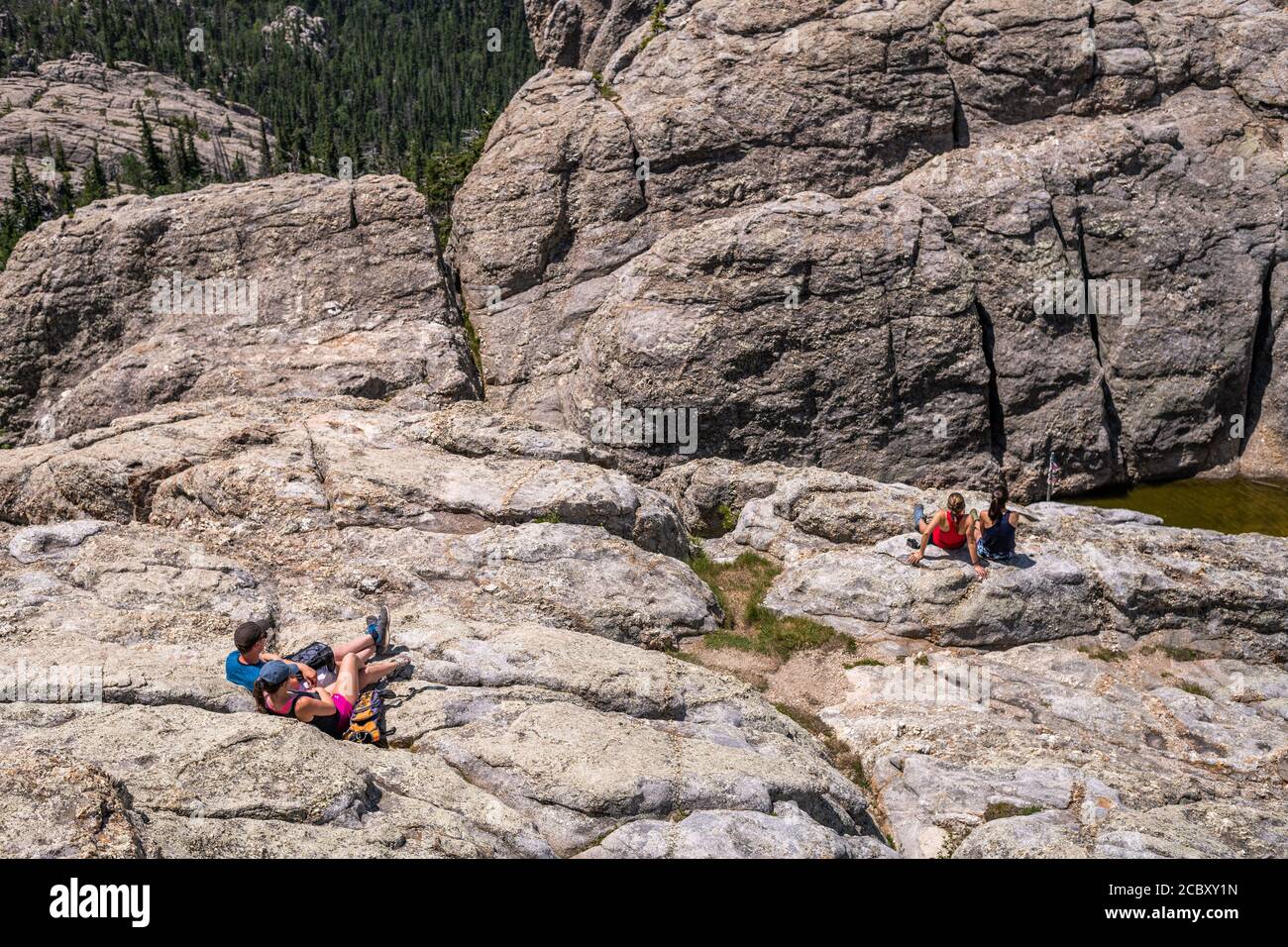 Hikers at the summit of Black Elk Peak, the highest point in South