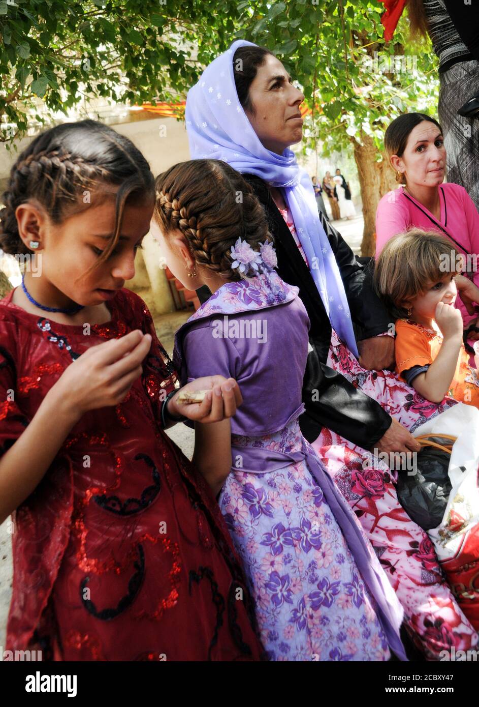Yezidi women and their children attending the annual religious festival of Yezidis in the town of Lalish, in the Kurdistan region of Northern Iraq. Stock Photo