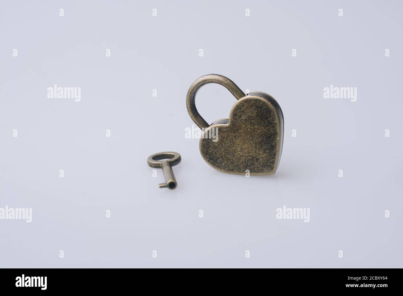 Metal padlock in heart shape as symbol of love Stock Photo - Alamy