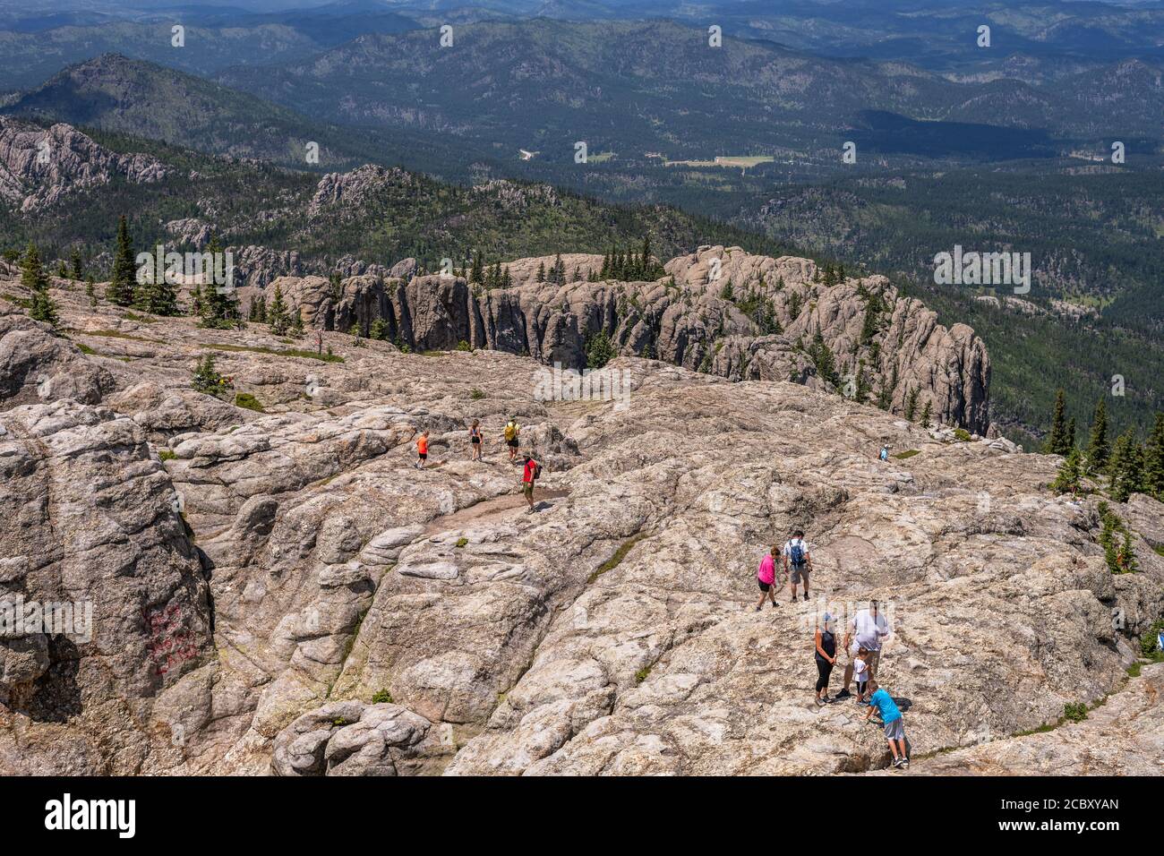 Hikers at the summit of Black Elk Peak, the highest point in South