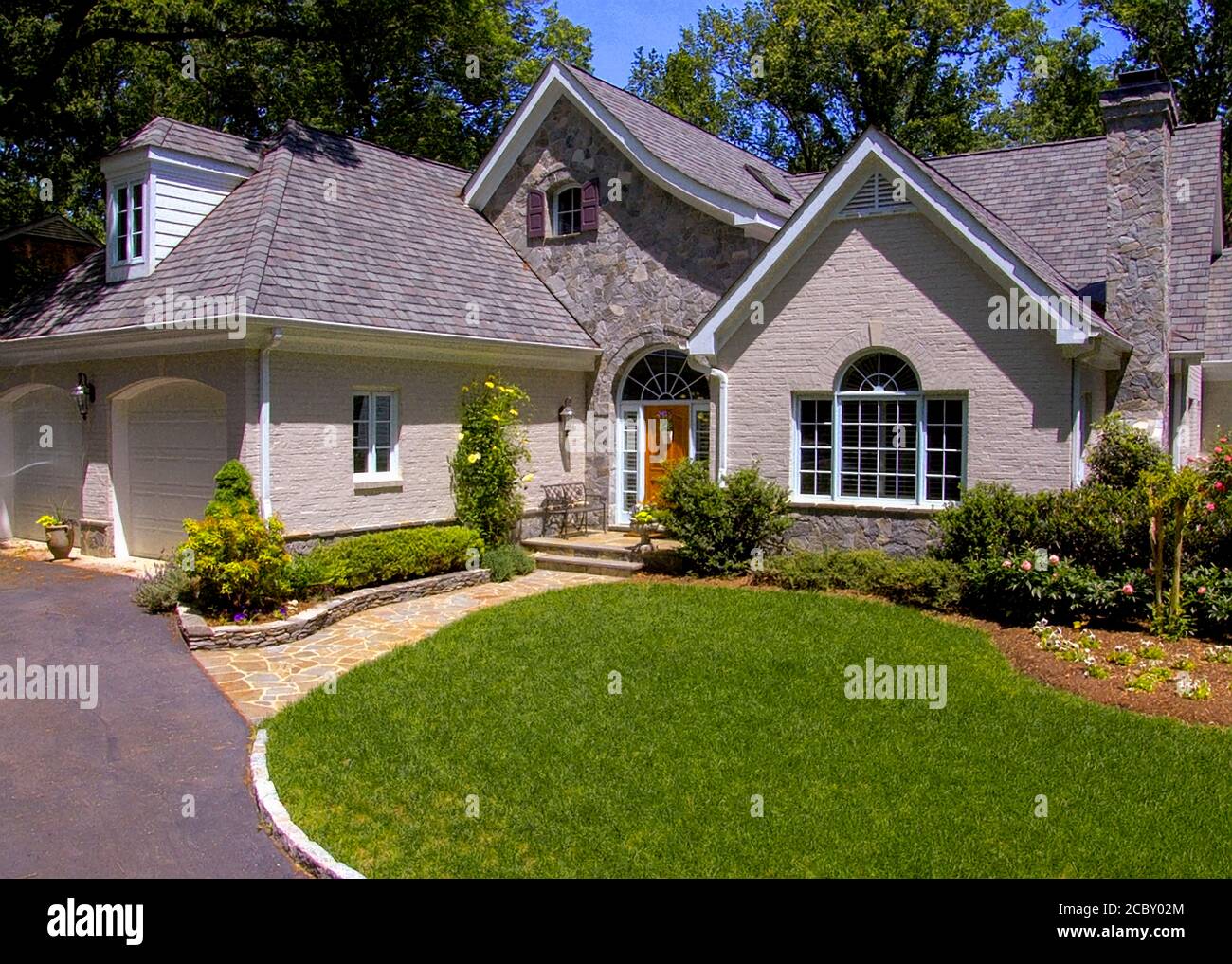 Multiple Angled Roofs-Front of Suburban house Stock Photo