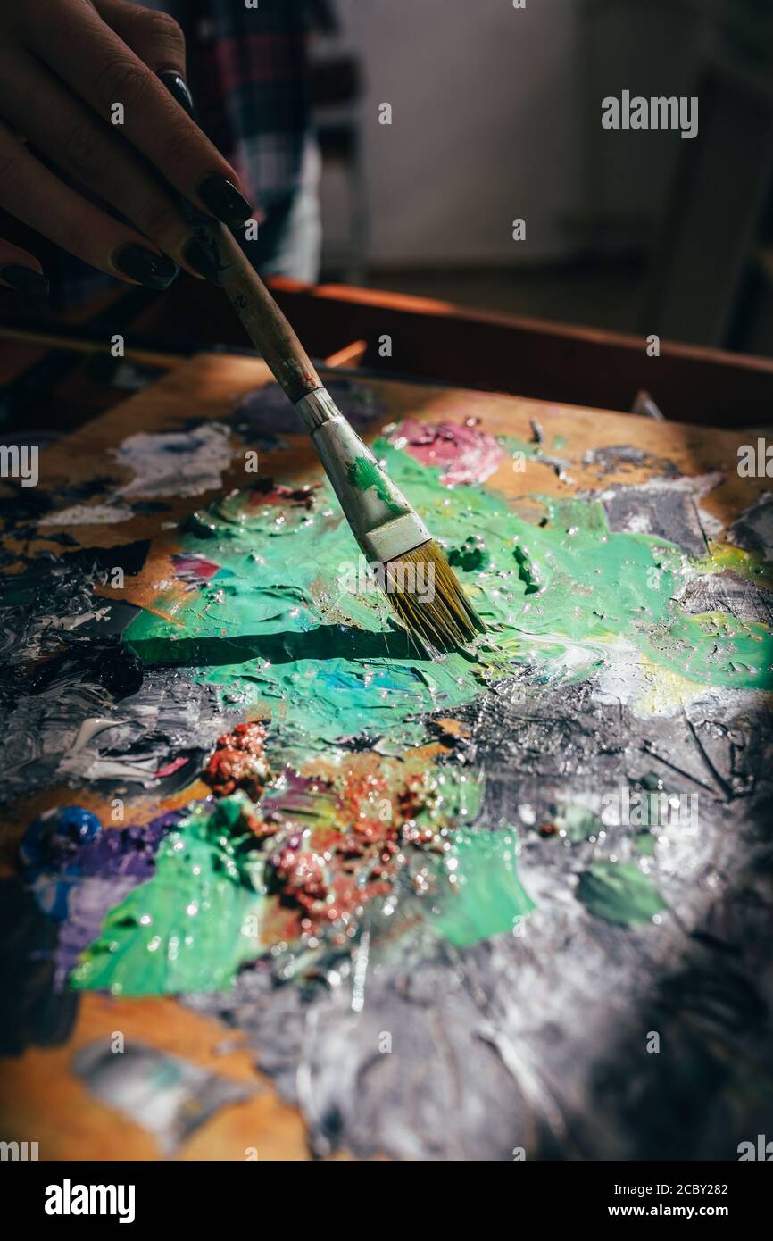 artist diluting paint. close up cropped photo. creative art Stock Photo