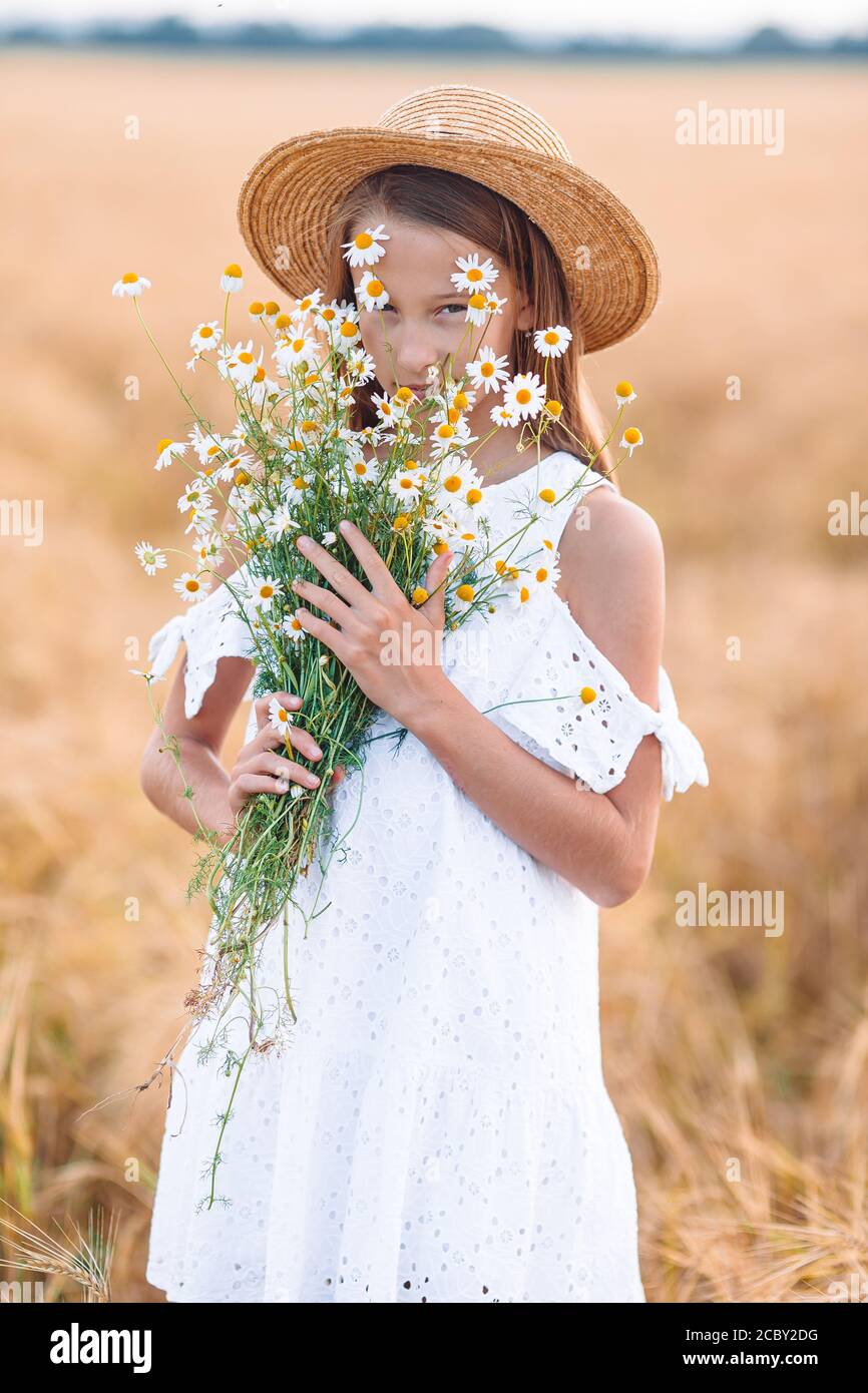 Happy cute girl in wheat field outdoors Stock Photo - Alamy