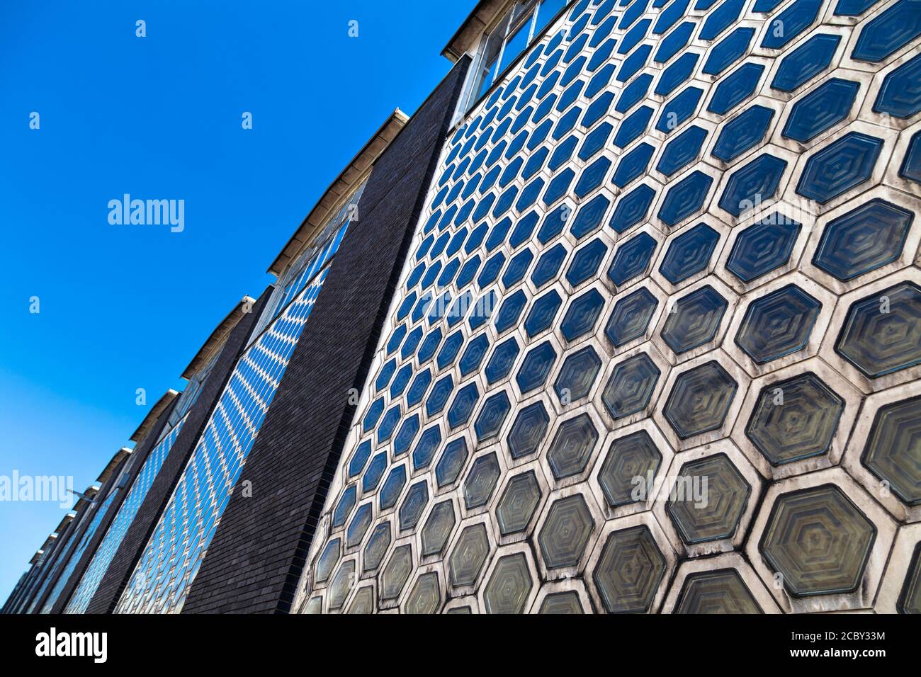 Hexagonal glass tiles on the facade of Smithfield Poultry Market, Farringdon, London, UK Stock Photo