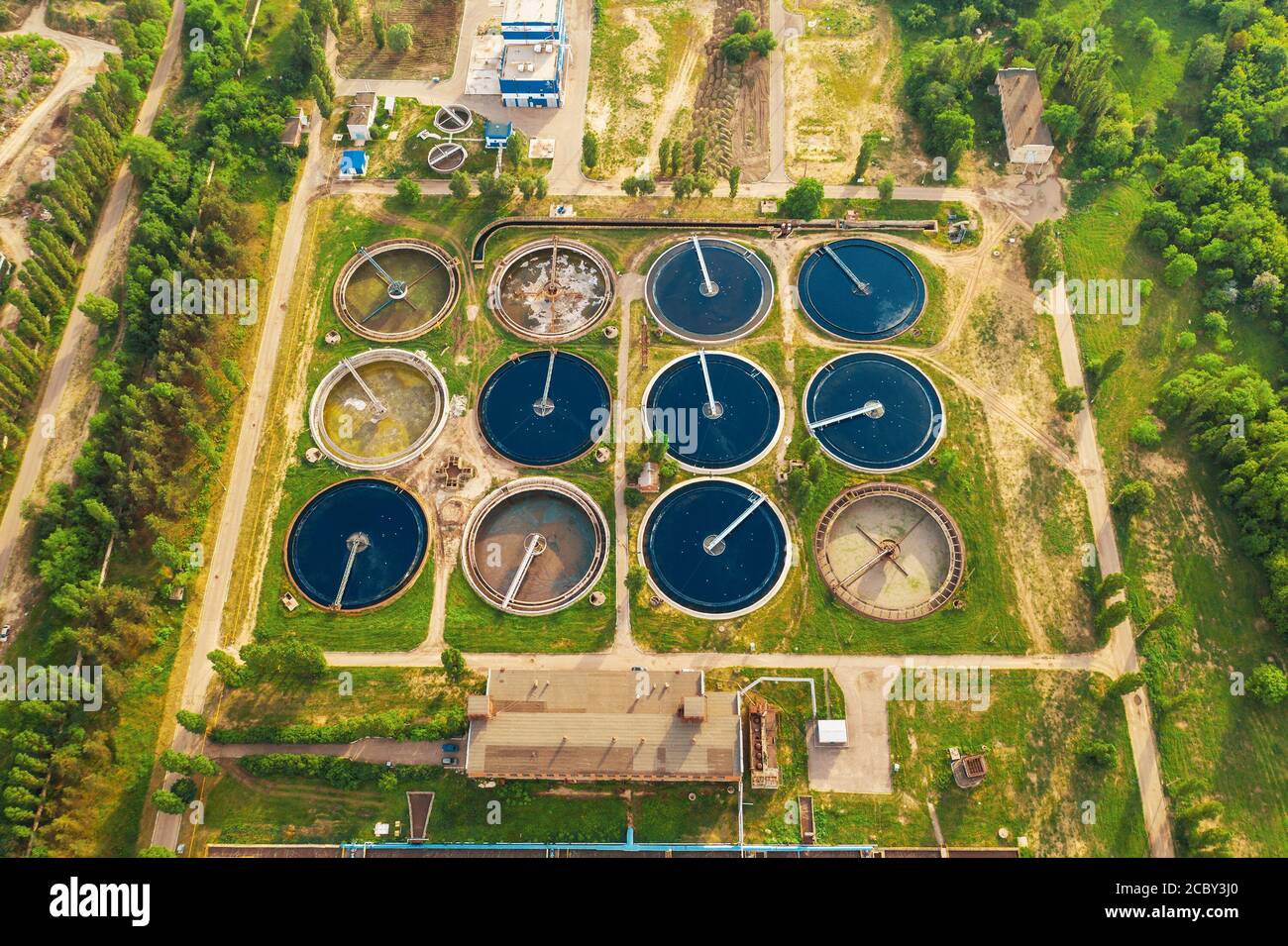 Wastewater treatment plant, filtration of dirty or sewage water, aerial top view. Stock Photo