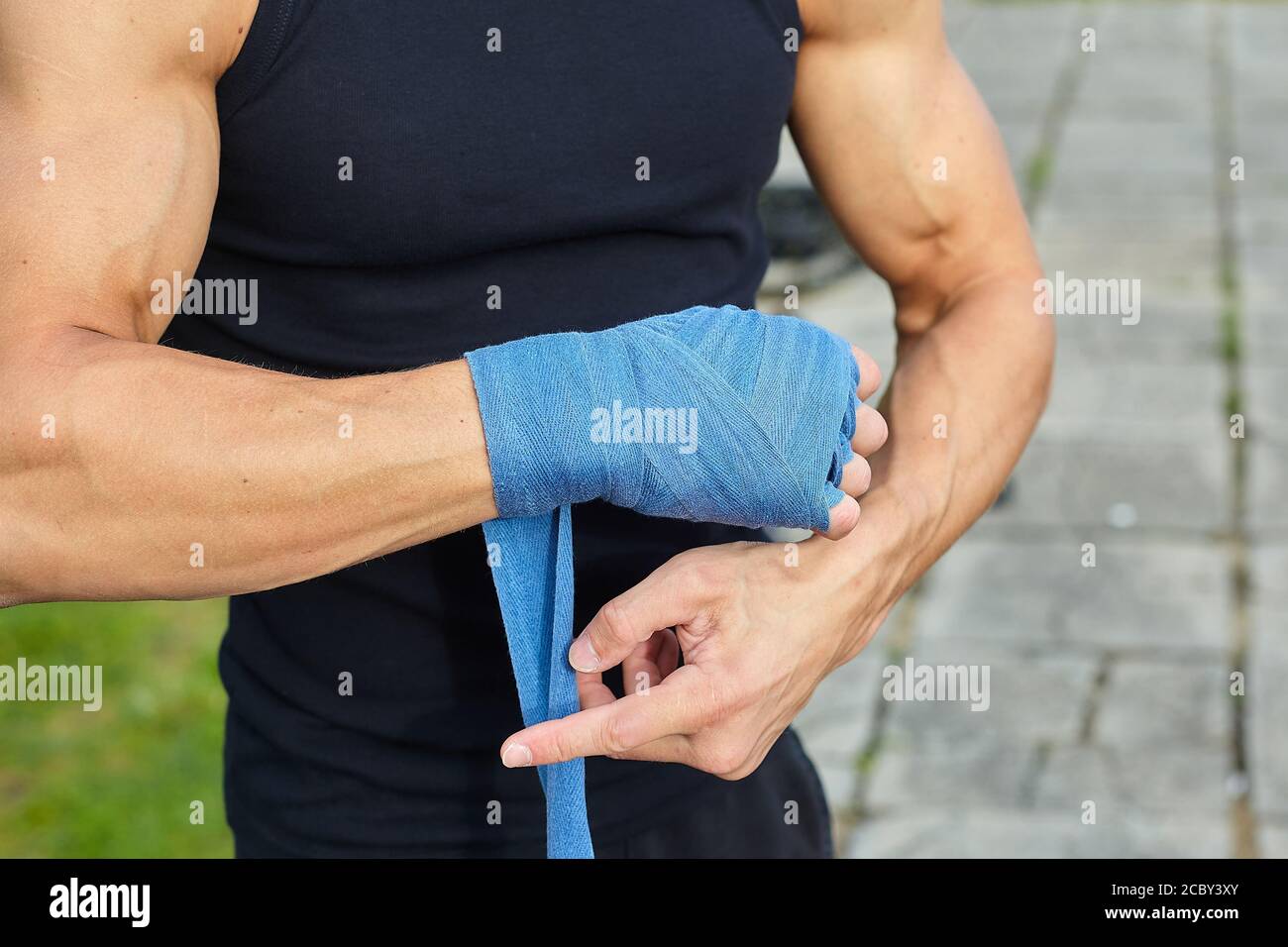 a man wraps his hands in Boxing bandages Stock Photo