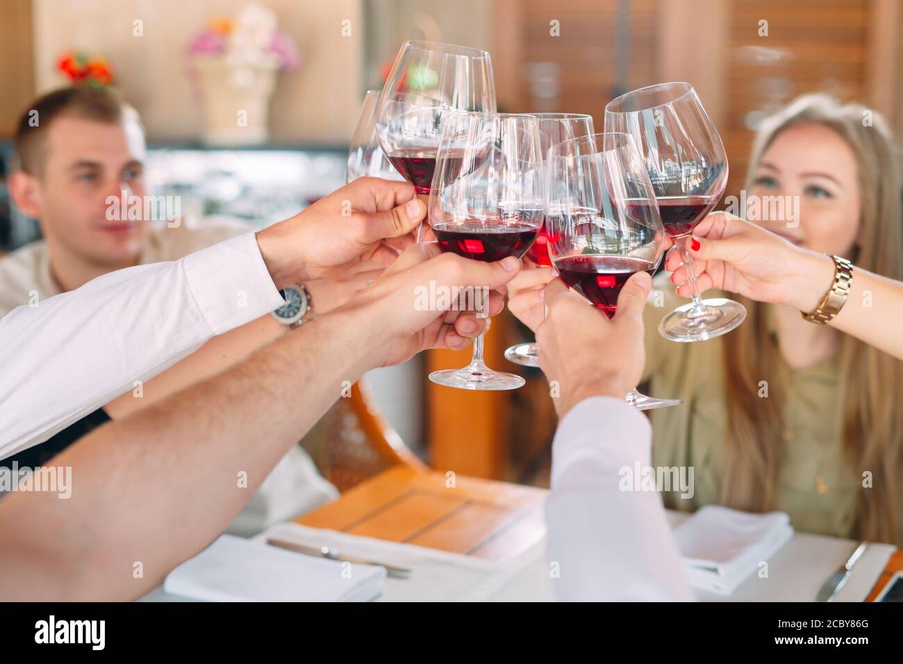Close-up Of Friends Toasting Wineglasses At Party Stock Photo