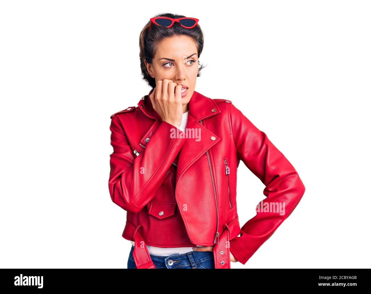 Young beautiful woman wearing red leather jacket looking stressed and  nervous with hands on mouth biting nails. anxiety problem Stock Photo -  Alamy