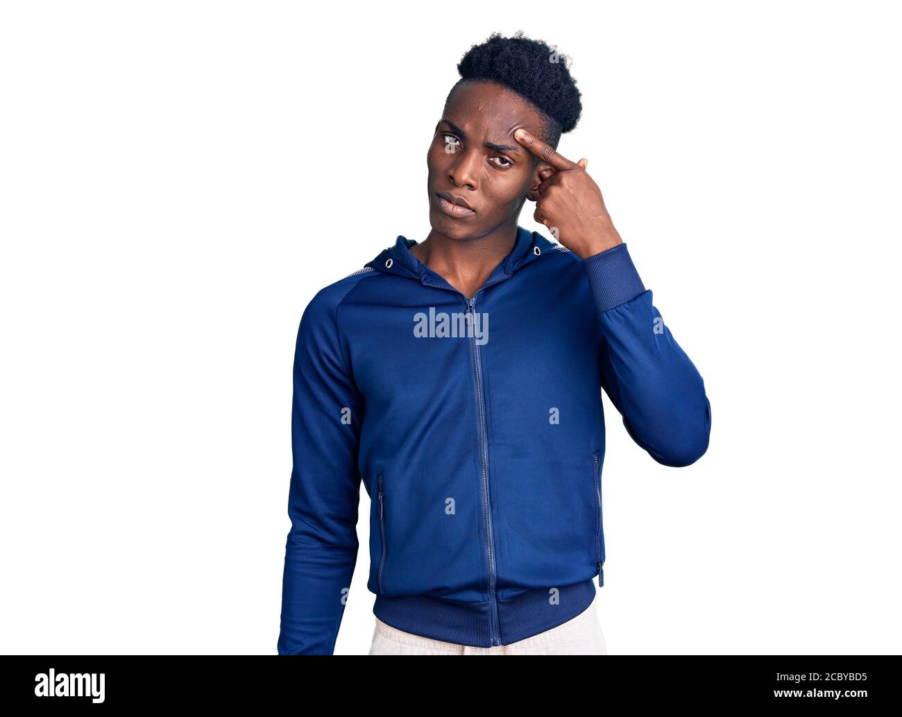 Young african american man wearing sportswear pointing unhappy to pimple on  forehead, ugly infection of blackhead. acne and skin problem Stock Photo -  Alamy