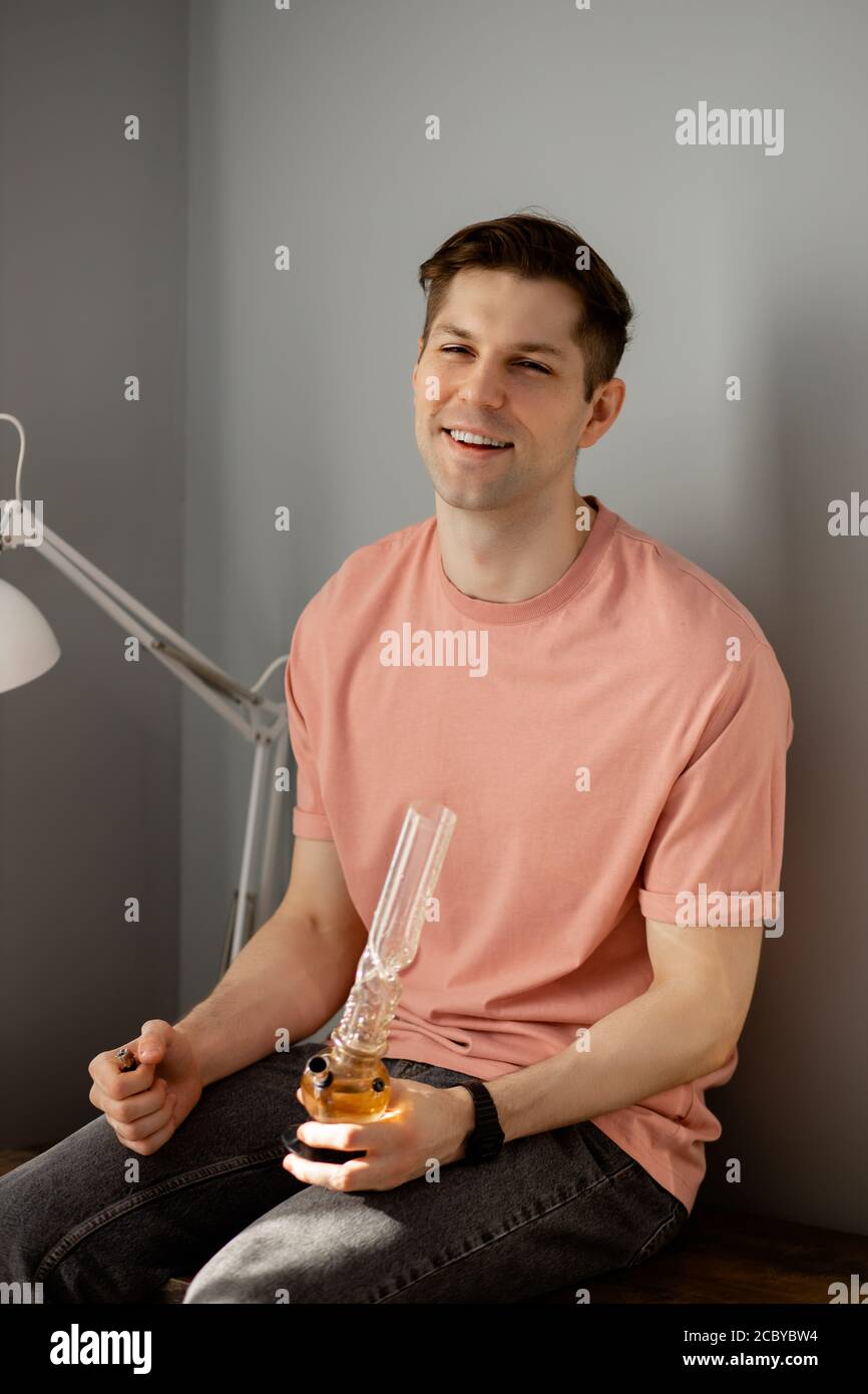 young caucasian man enjoy using drugs at home, he has problems with