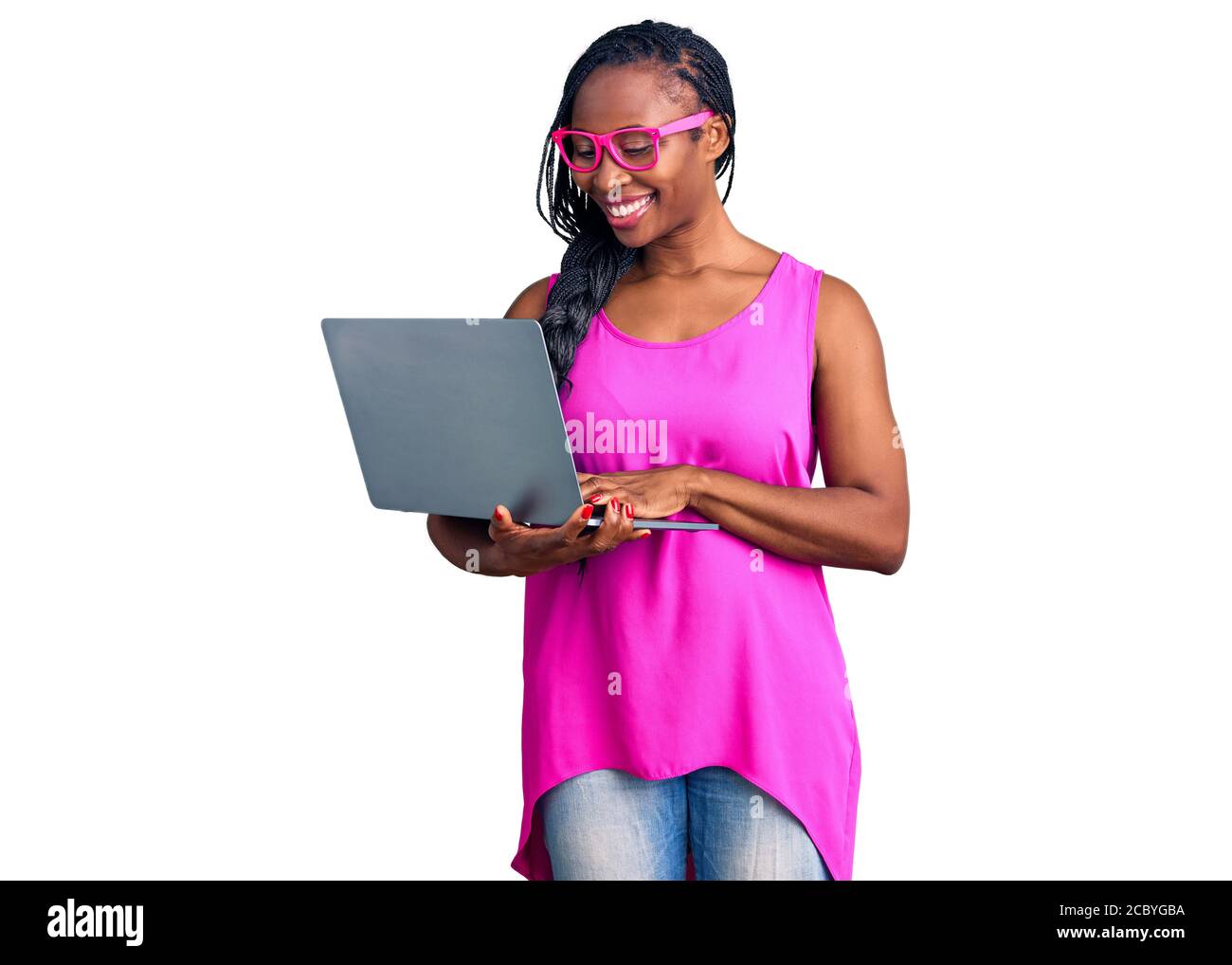 Young african american woman working using computer laptop looking ...