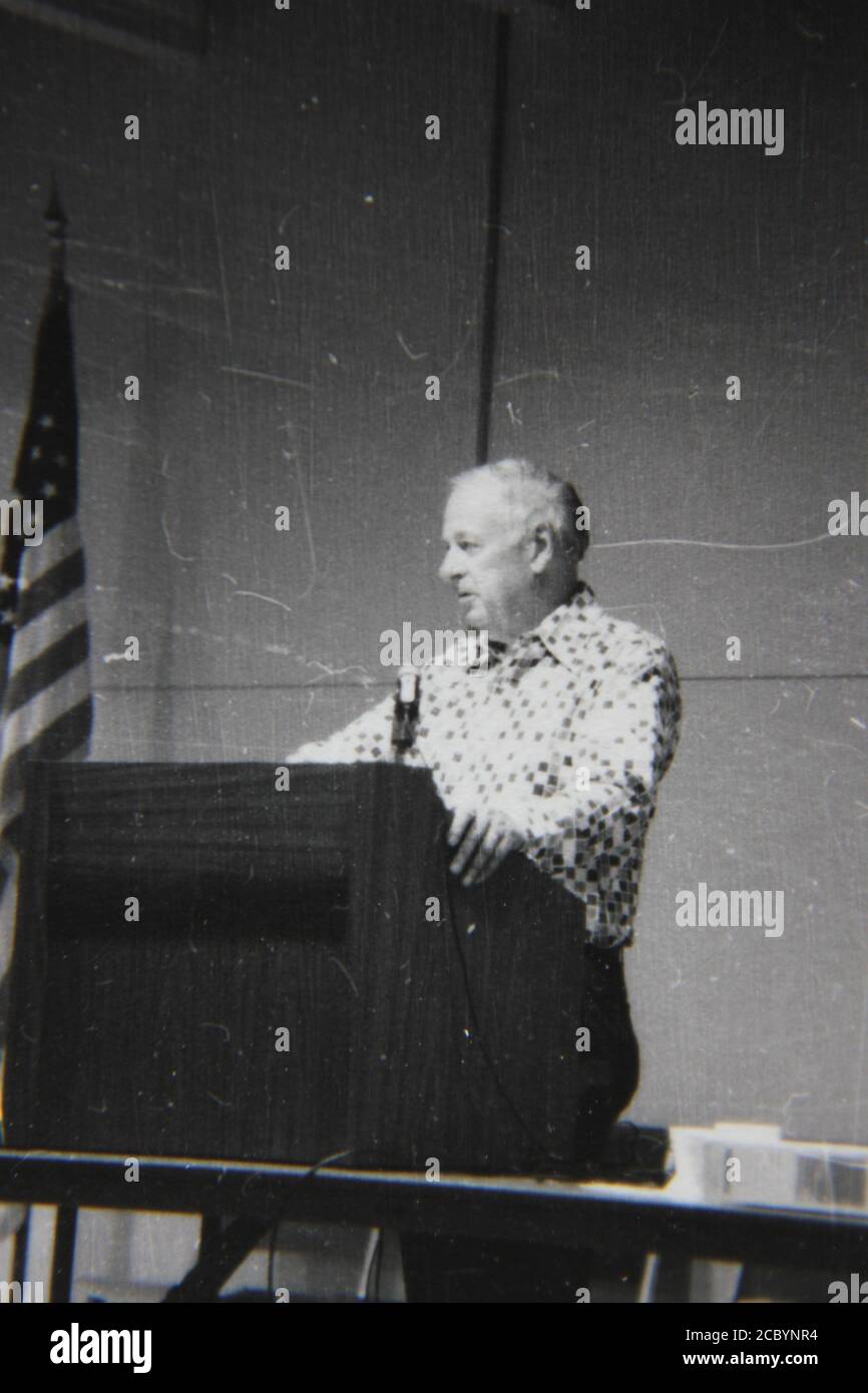 Fine 1970s vintage black and white photography of a speaker standing at ...